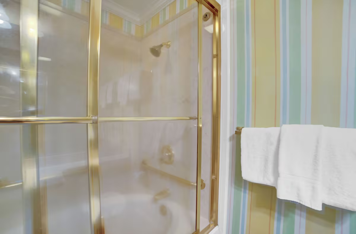 Primary en-suite bathroom will have double vanity, a separate water closet with a single vanity and a jetted tub with tiled shower walls so multiple guests can get ready at the same time. I will be removing the wallpaper and painting the walls as well. 