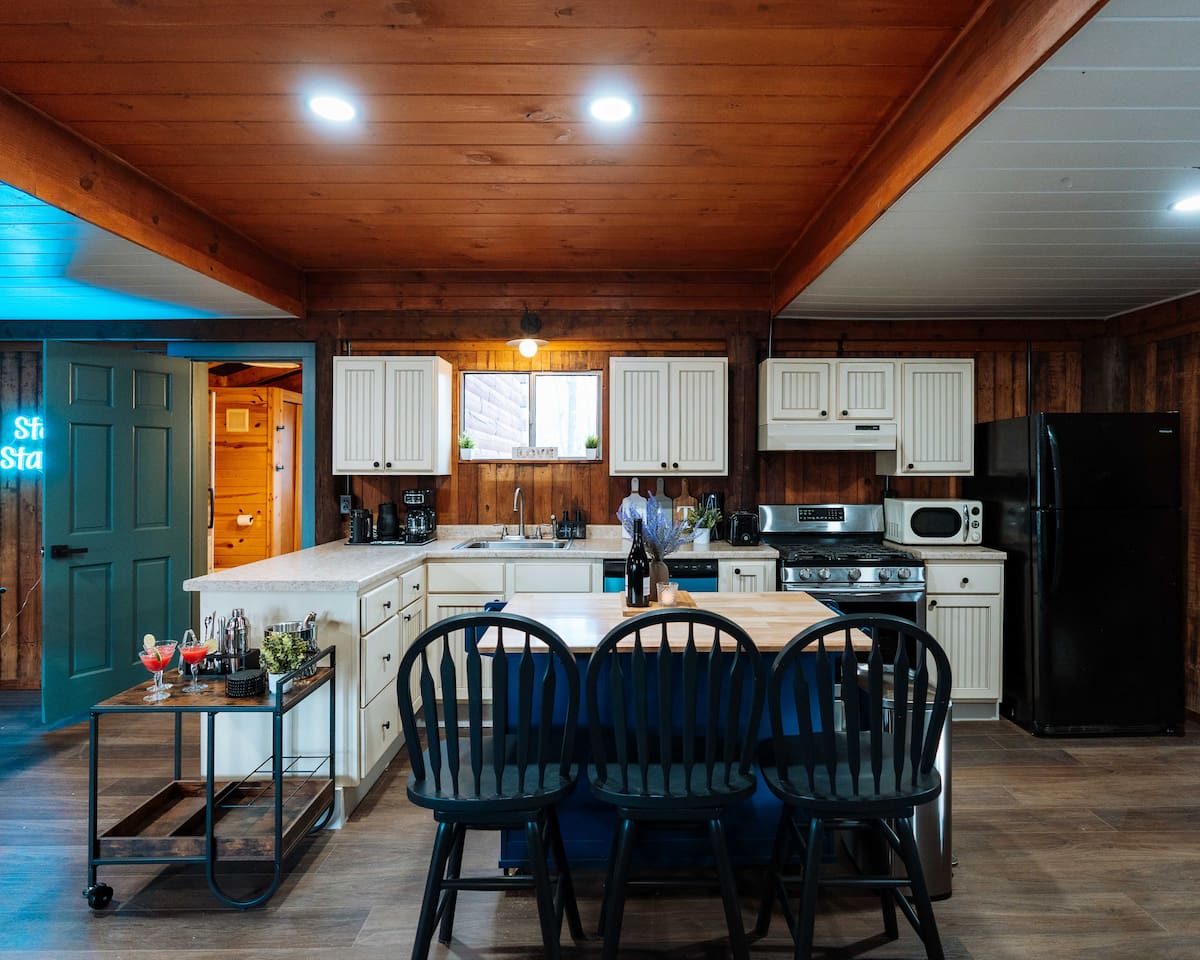 A chef-ready space featuring a dishwasher and all the tools for an effortless forest feast