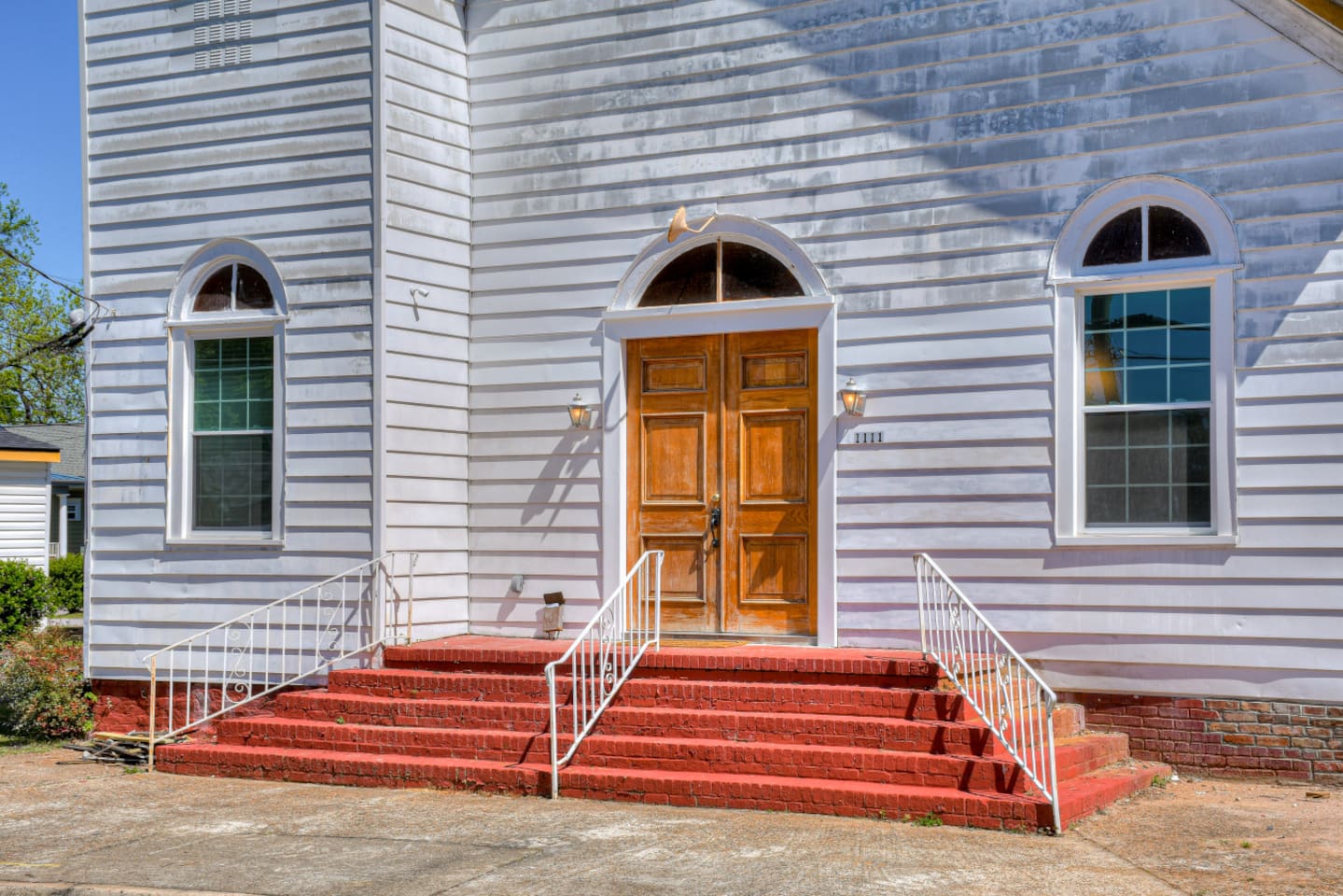 Original red steps leading to the grand church entrance.