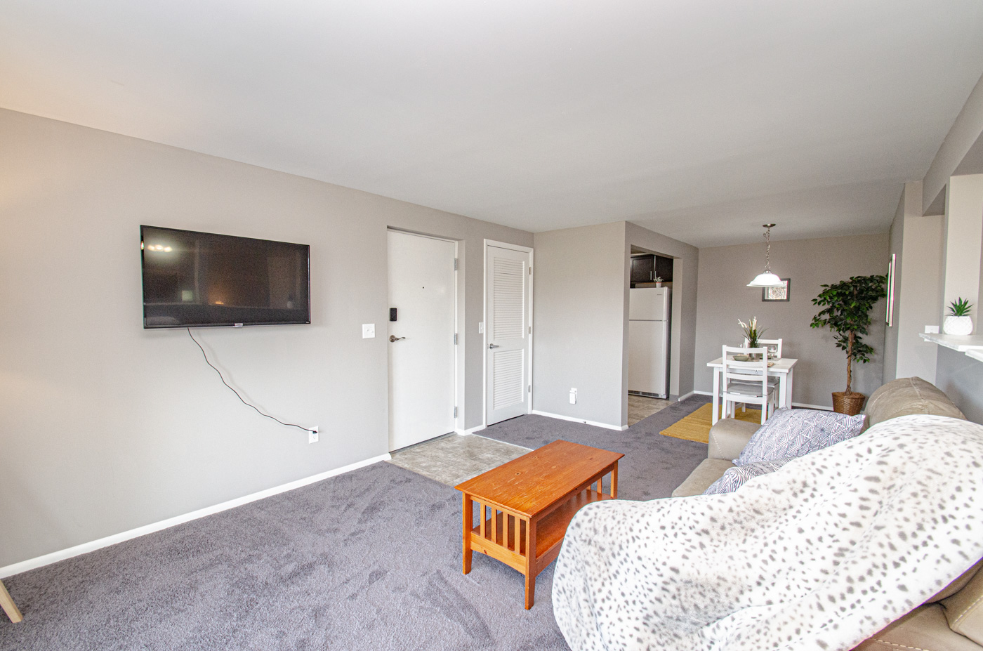 Living room is open to dining room and kitchen.