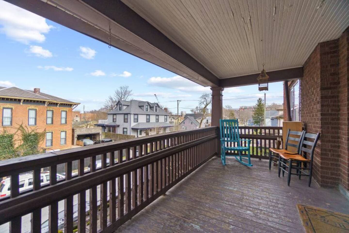 Charming balcony with comfortable sitting furniture, perfect for relaxing and enjoying the view.