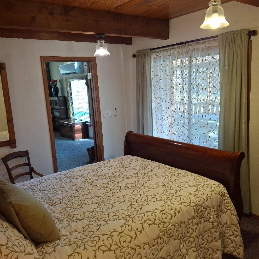 Garden Room sliding door to back covered deck.