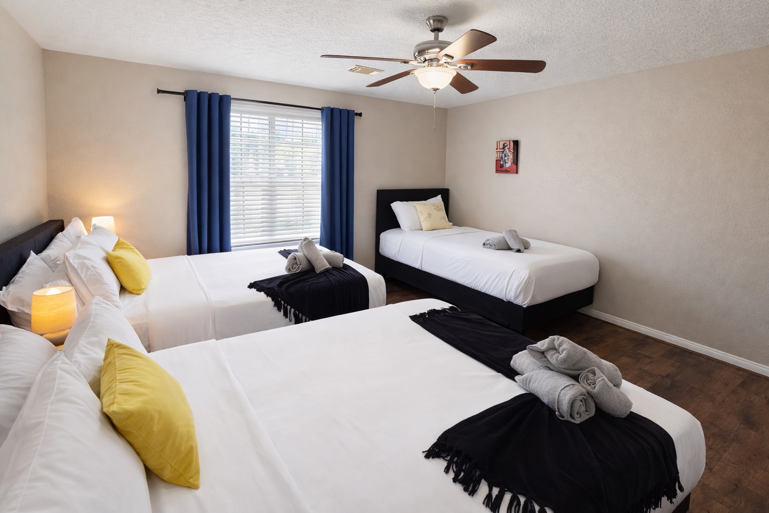 Bright and comfortable room with two Queen beds plus a Twin — ideal for friends, kids, or group travel. Plenty of space to spread out and unwind after a fun day.
