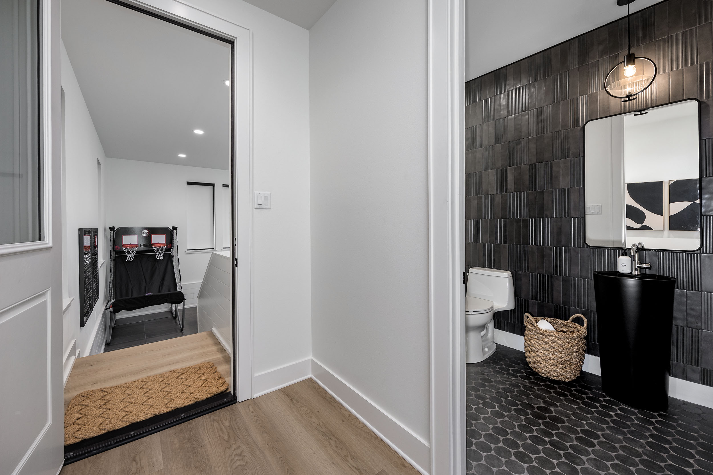 Conveniently located half bath located right next to the game room and the living room.