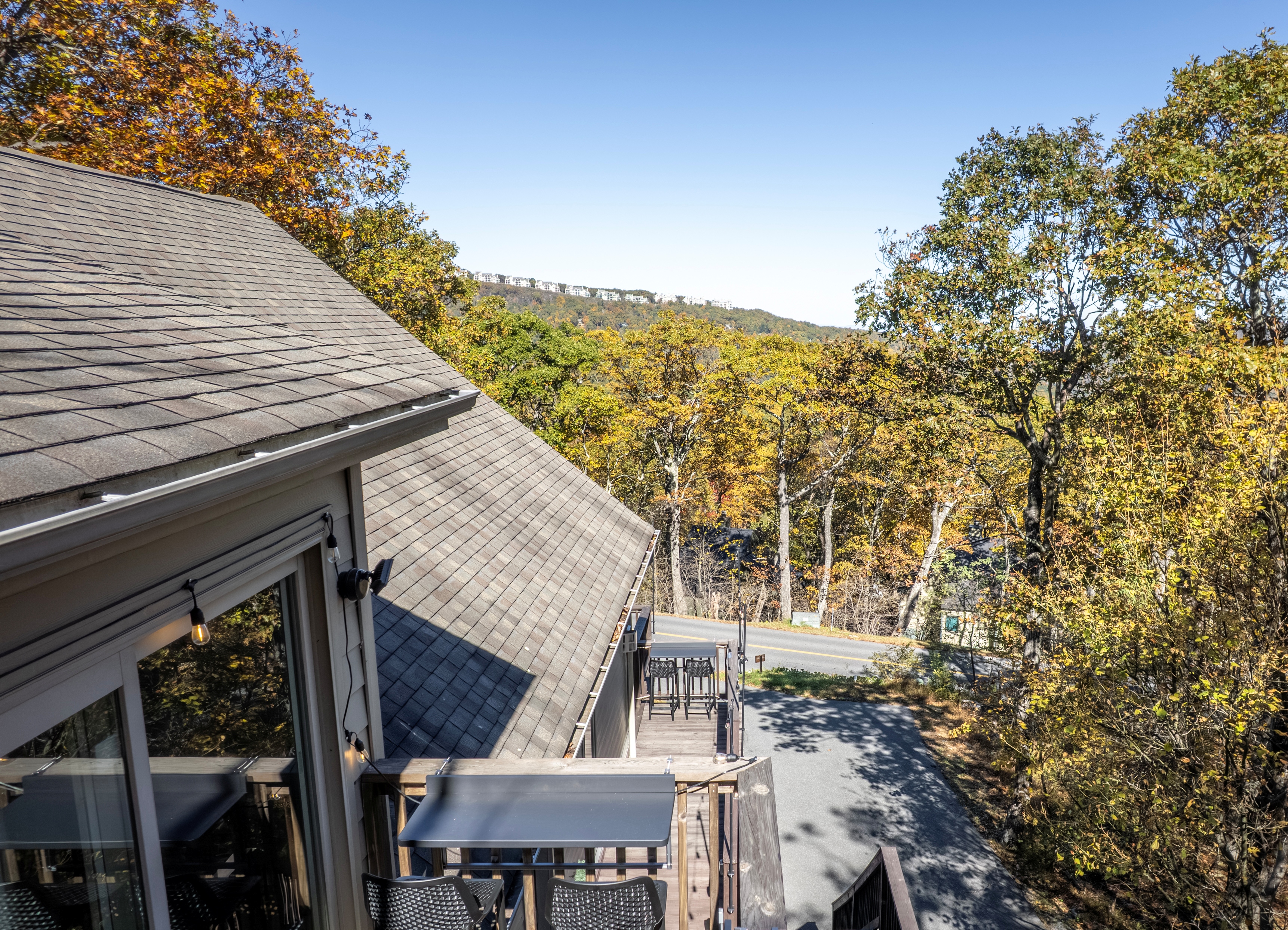 Morning view from the Vista Balcony—golden fall trees and clear skies stretch toward the Blue Ridge, showcasing beauty beyond last night’s sunset.
