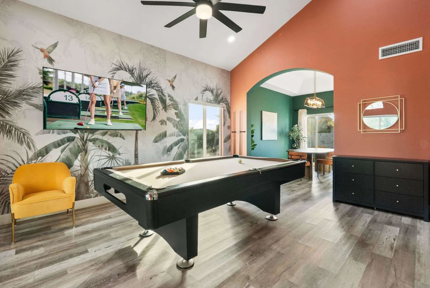 Game room with pool table, golf simulator, and entertainment lounge—the ultimate hangout space.