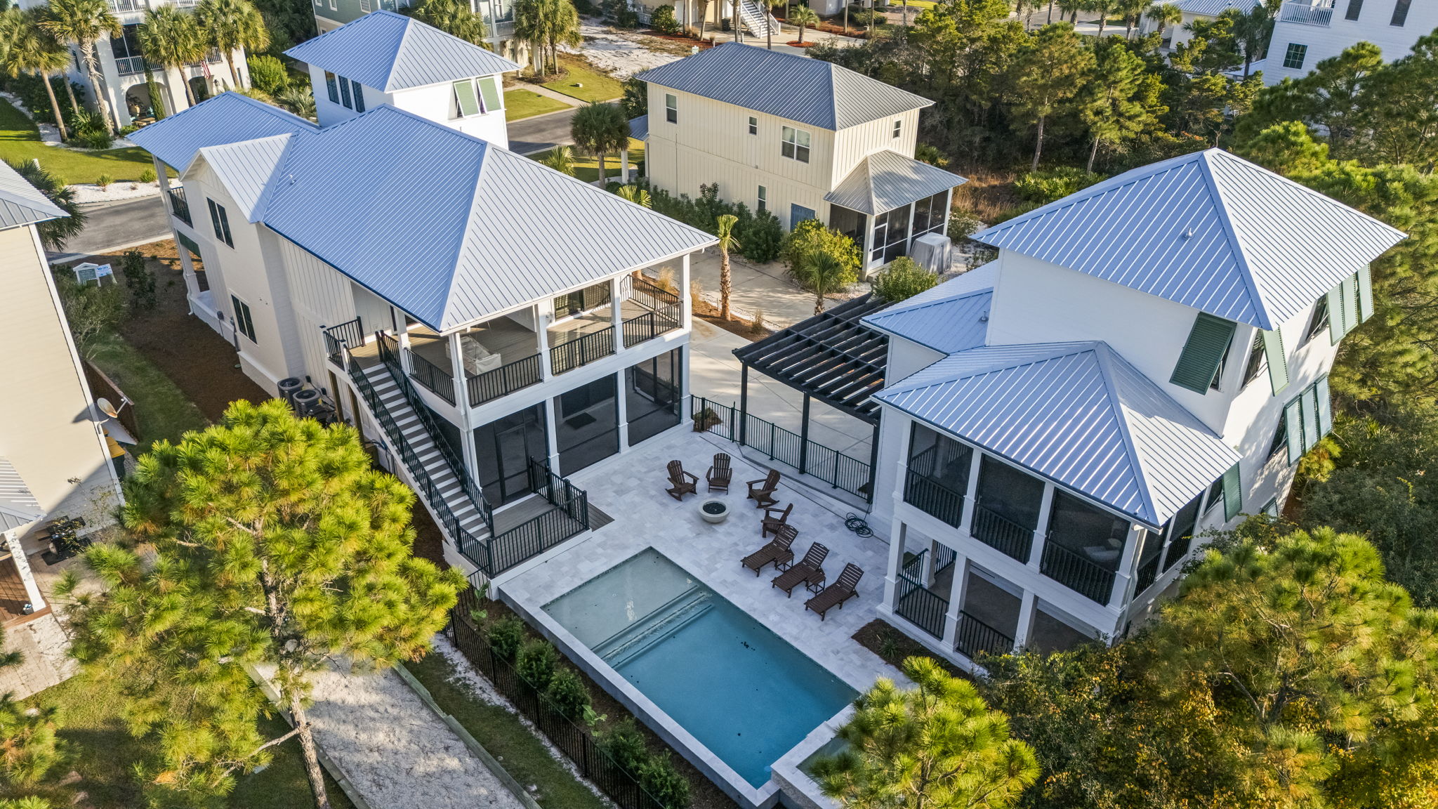 Gather around your private pool, hot tub, and glowing fire bowl after a day at the beach at this peaceful retreat featuring a spacious 4-bedroom main house and charming 2-bedroom guest house—perfect for unforgettable group getaways with family and friends