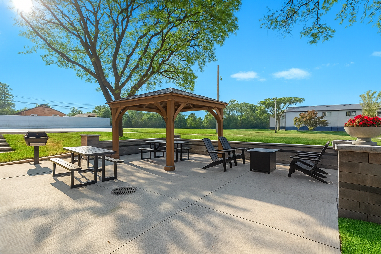 Spacious outdoor patio with seating for dining, lounging, or enjoying sunny days in the fresh air.