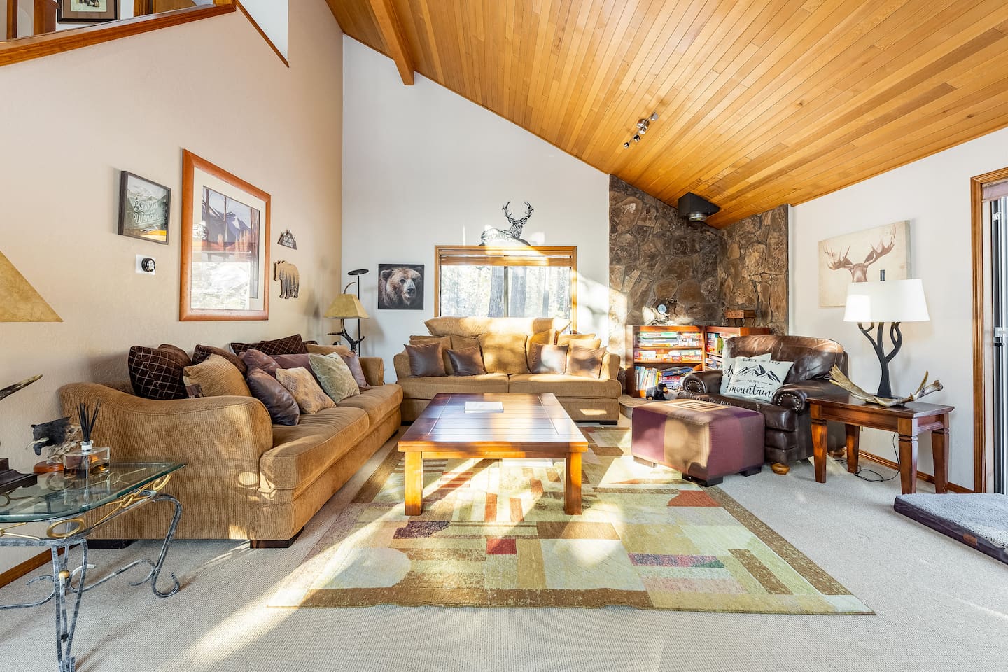 Downstairs the large living room features plenty of places to cozy up. Another 75" TV with Chromecast and a blu-ray player also adorns this space. We just got new floors in the living room in November, 2024!