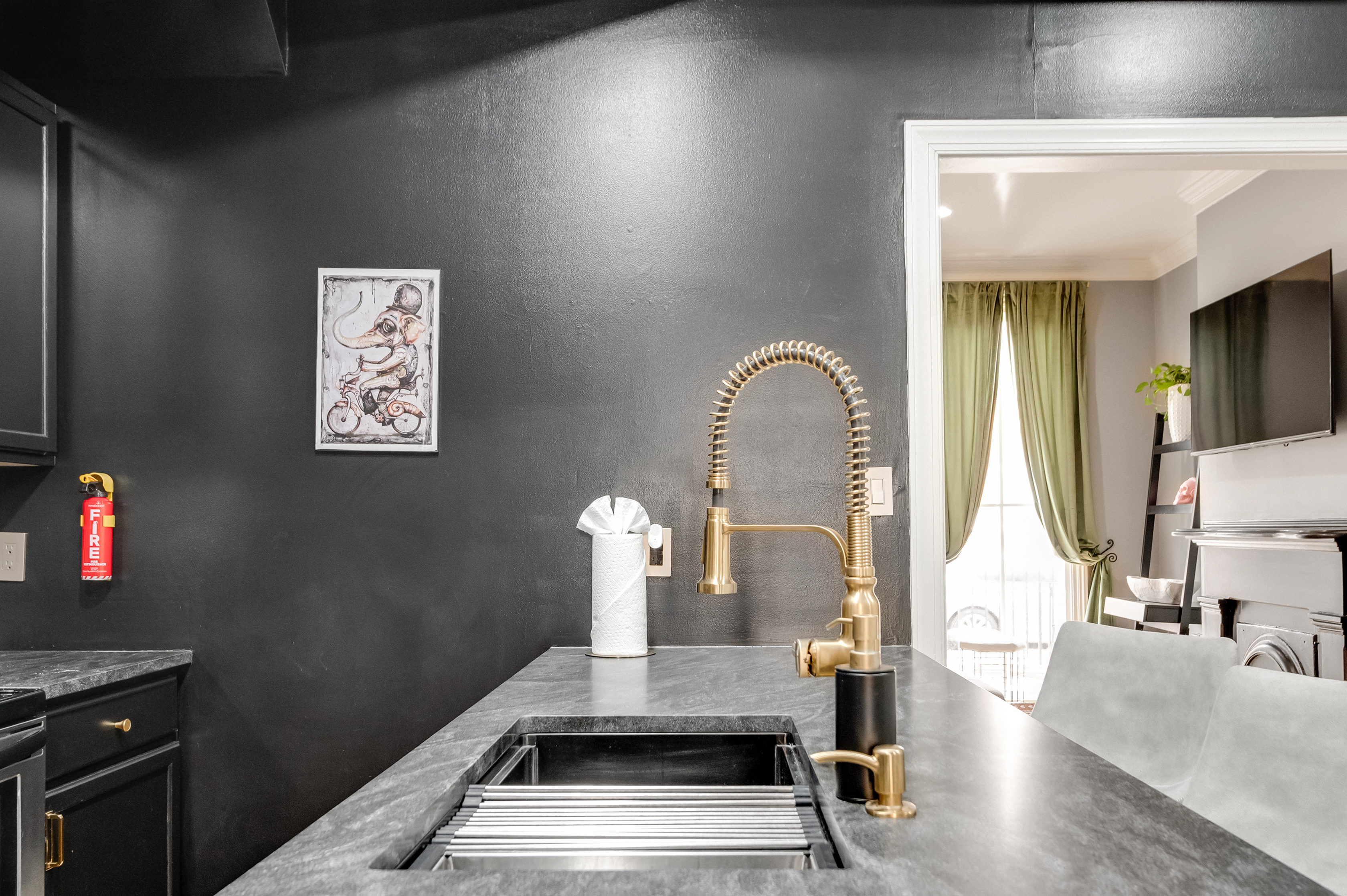 Chic Kitchen: Experience culinary adventures with stylish decor and modern, golden fixtures!