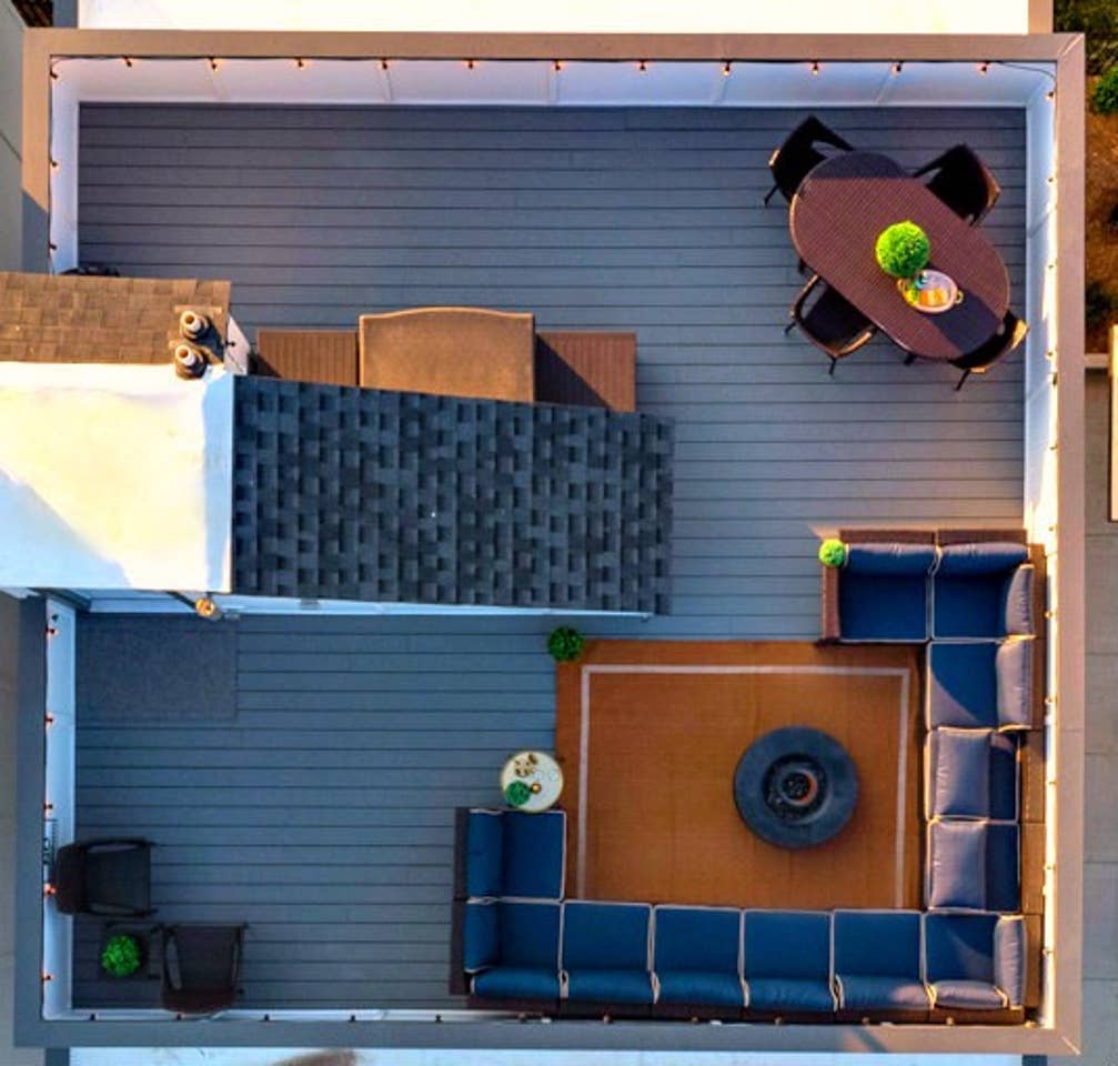 - Stunning rooftop patio with cozy sectional seating perfect for group gatherings - Central fire pit adds warmth and ambiance for evening relaxation - Enjoy sunrise coffee or sunset drinks with elevated views all around