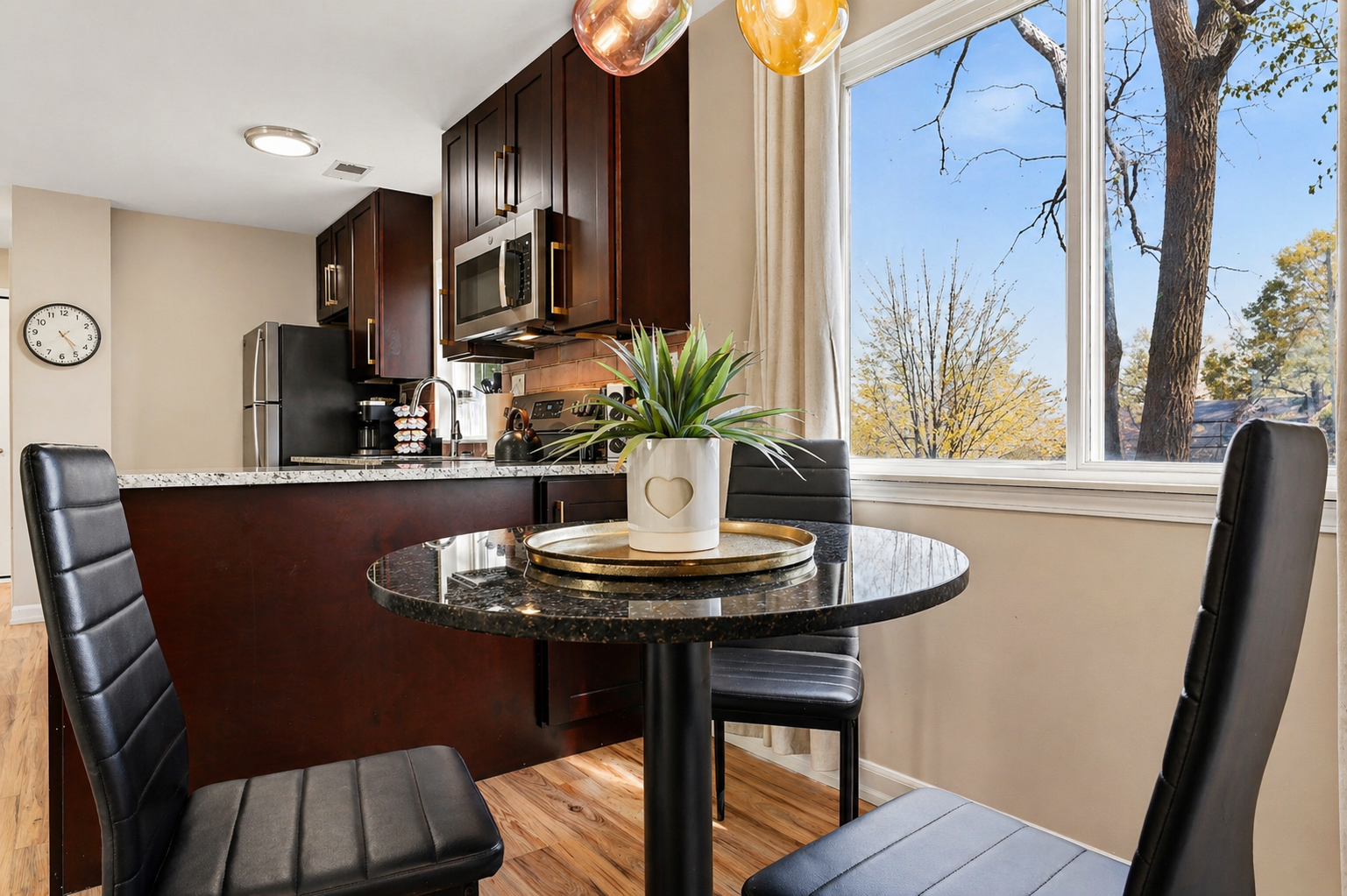 Enjoy gatherings in your charming dining room with a view. A cozy space to share meals and create wonderful memories.