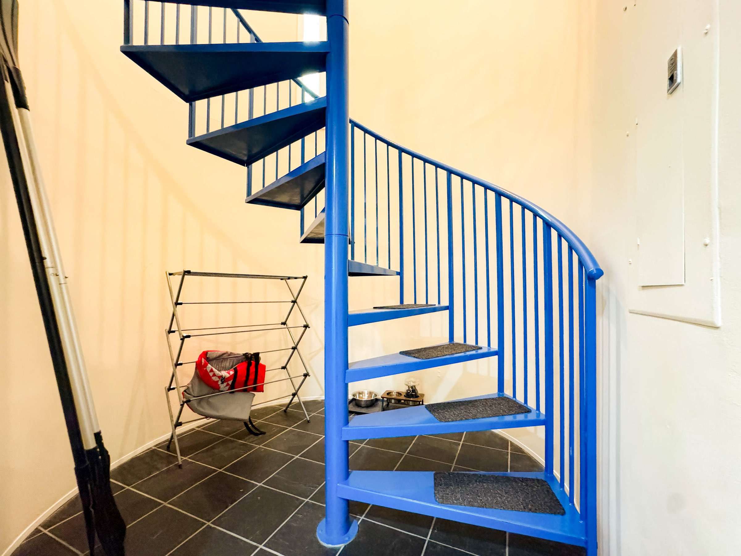 Paddles for the kayaks as well as life jackets provided for your stay. The spiral staircase leads you to the two upstairs bedrooms.