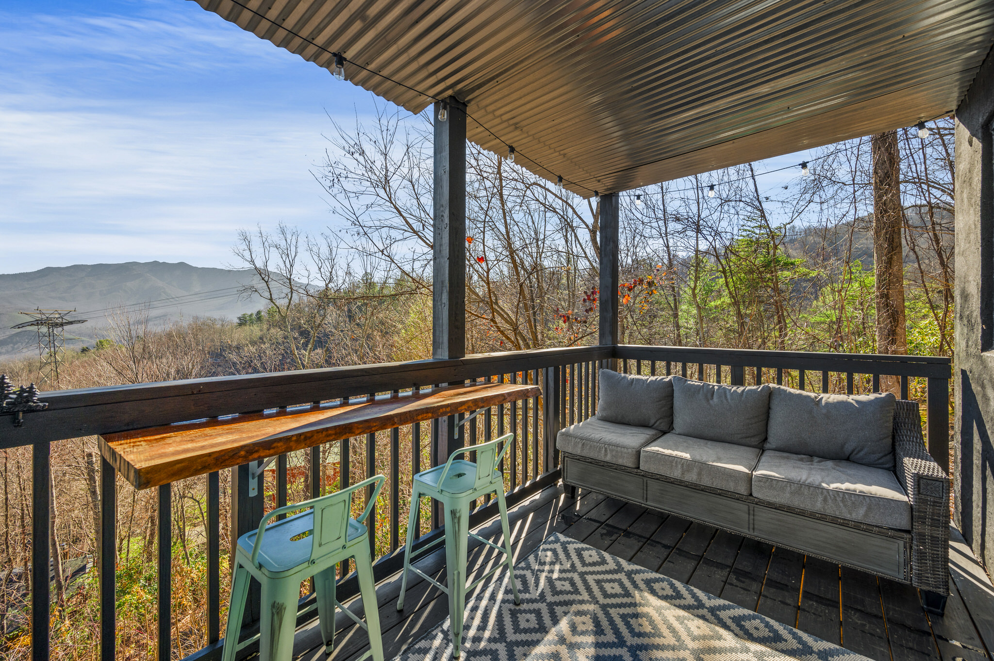 The lower deck offers views and comfortable seating along with the hot tub.  Soak a little then cool down and repeat!