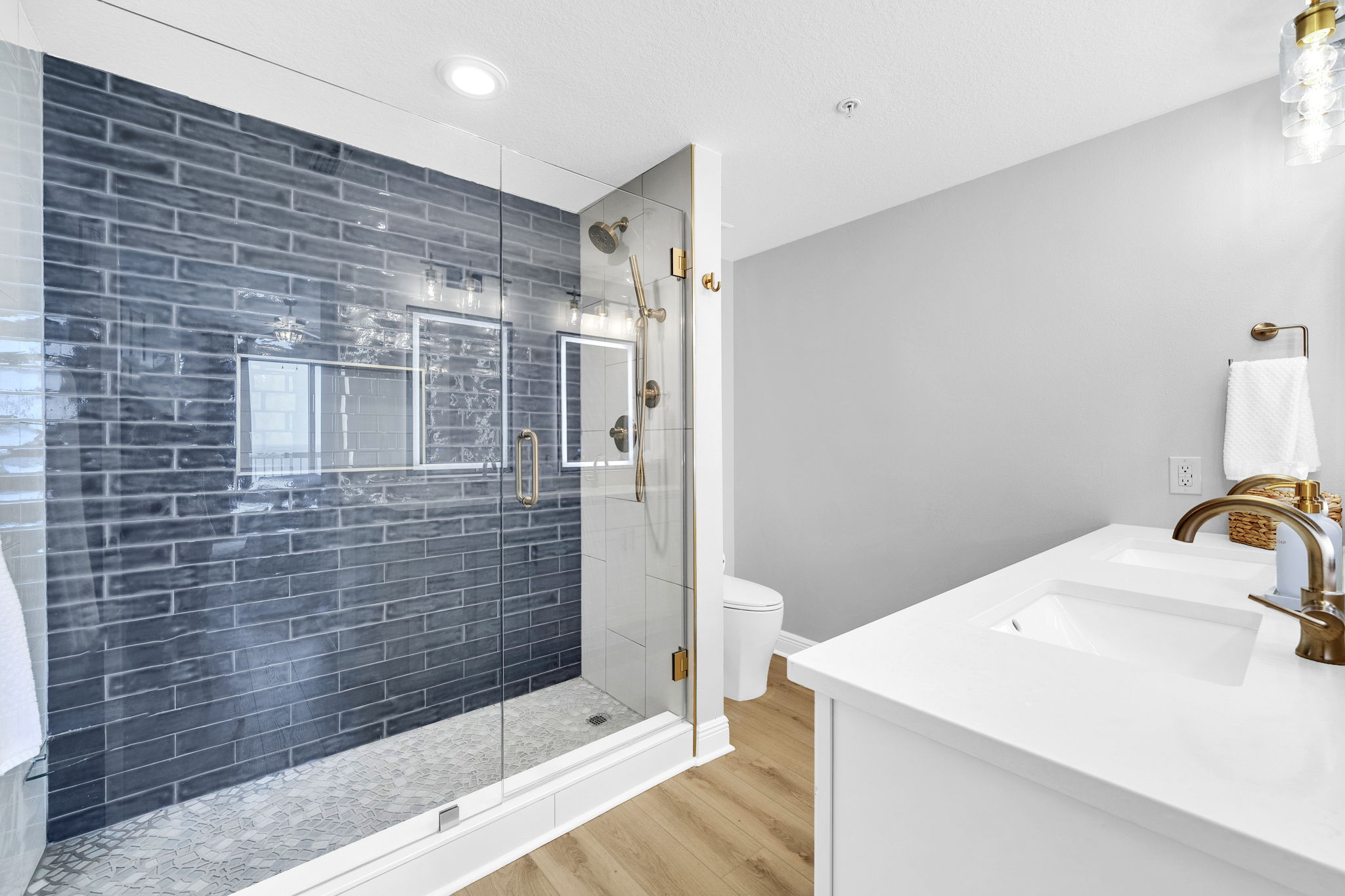 Completely renovated with elevated finishes, this primary en suite features a spacious walk-in tile shower and a comfort-height toilet for added comfort.