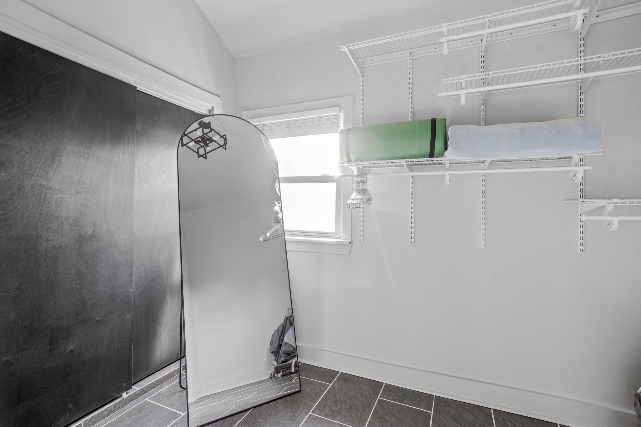 Store your belongings and clothes in the expansive primary bedroom closet.