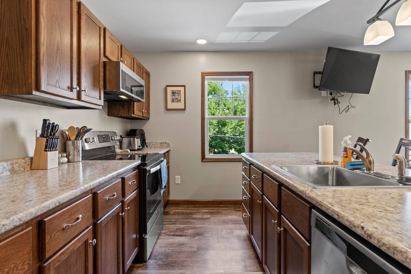 Fully equipped kitchen with a spacious countertop and ample cabinets, providing plenty of storage and space for all your cooking needs.