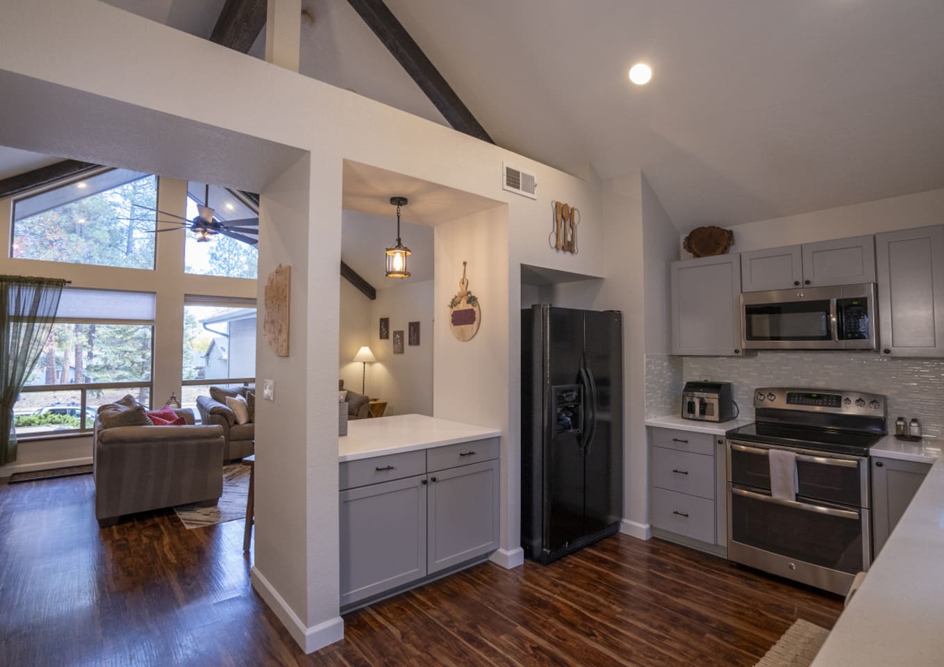 Kitchen view with full-size appliances, extra counter space, and open access to the living area.