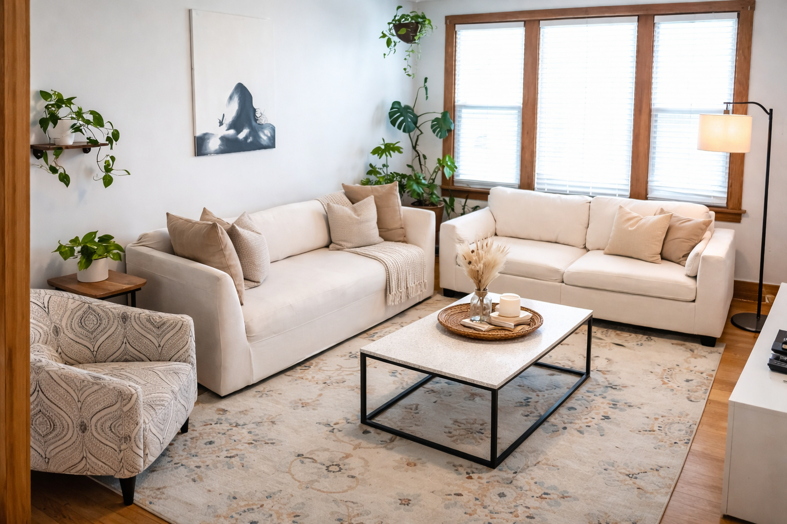 Comfortable lounge area with warm natural light and plenty of seating for group conversations, movie nights, or remote work.