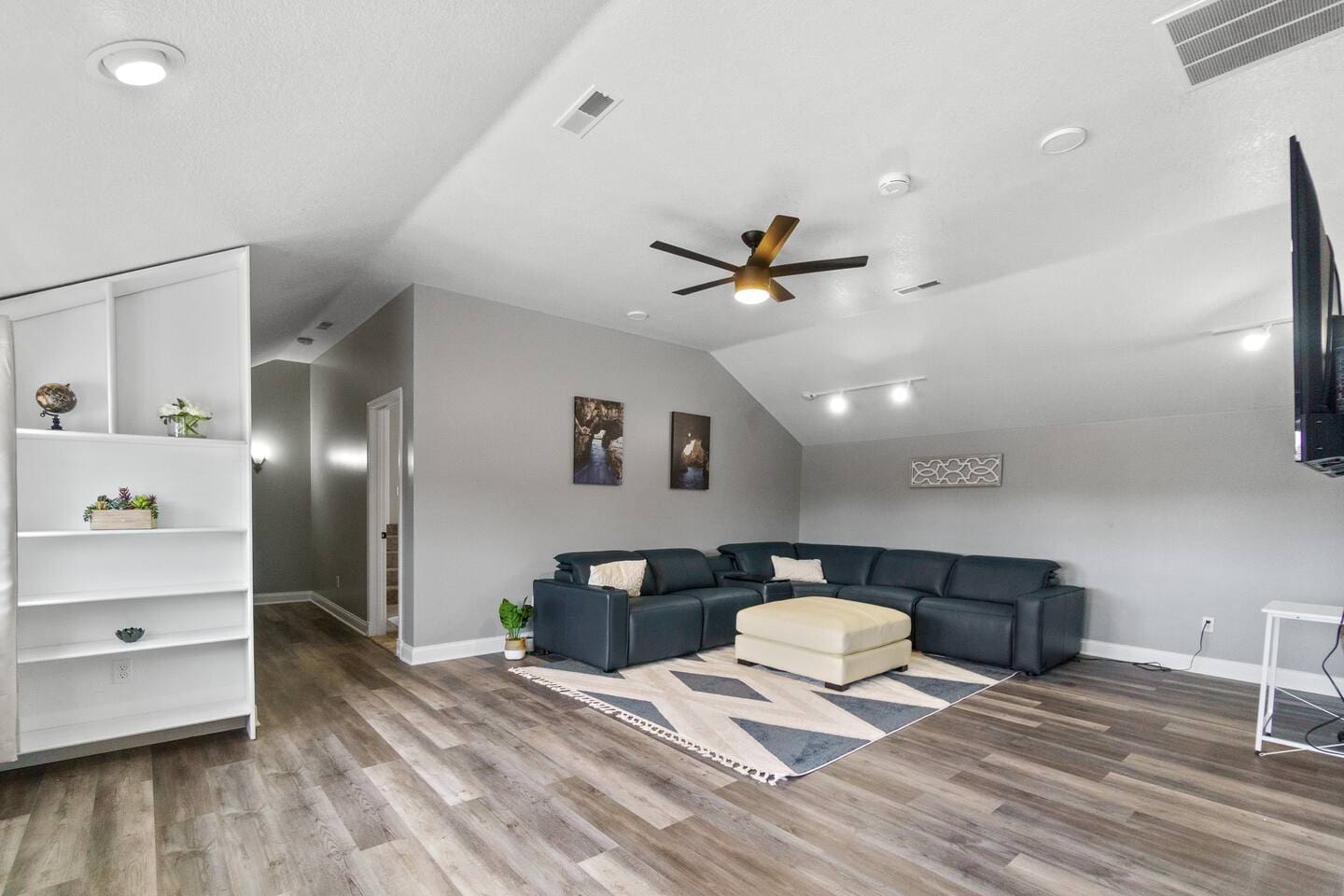 Cozy living room featuring a comfortable couch, and soft area carpet, perfect for relaxation and entertainment.