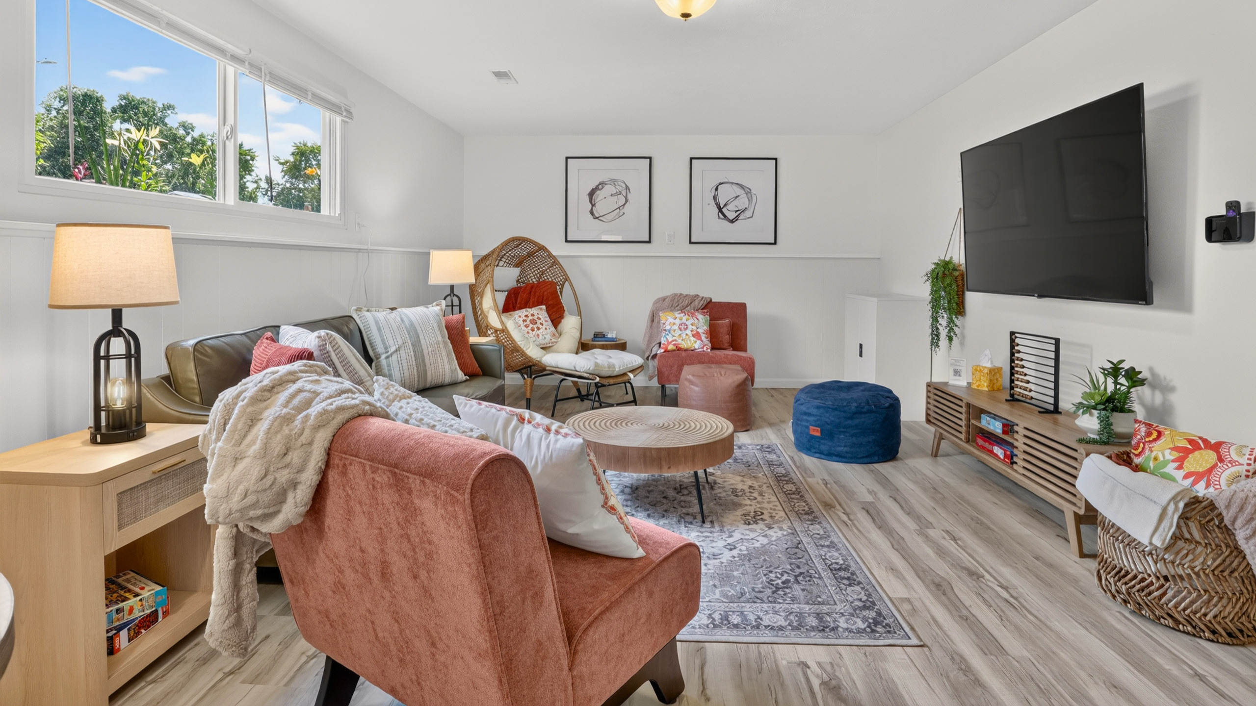 Designed for gathering with cozy seating, a 65" Smart TV, and room for everyone.
