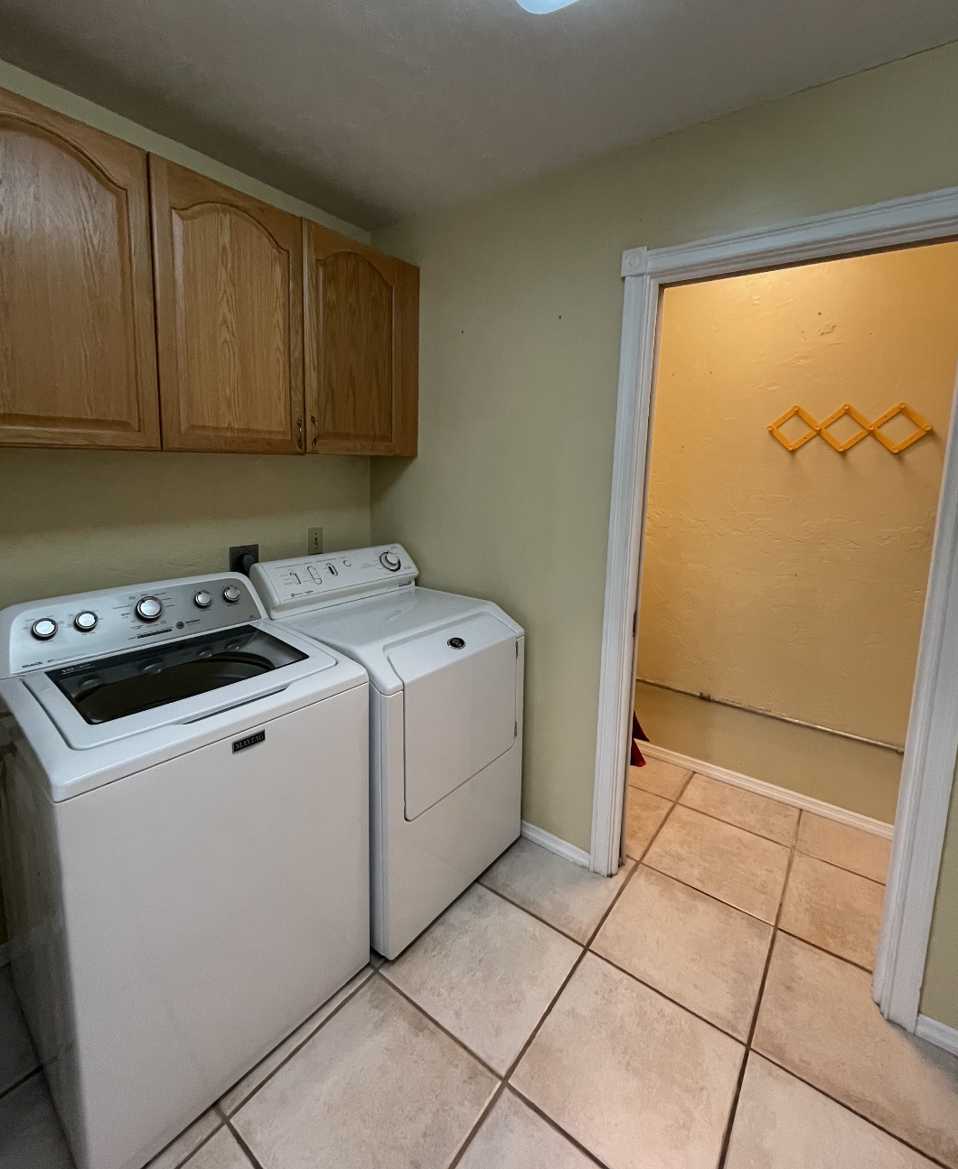 The laundry room is located just off the kitchen.