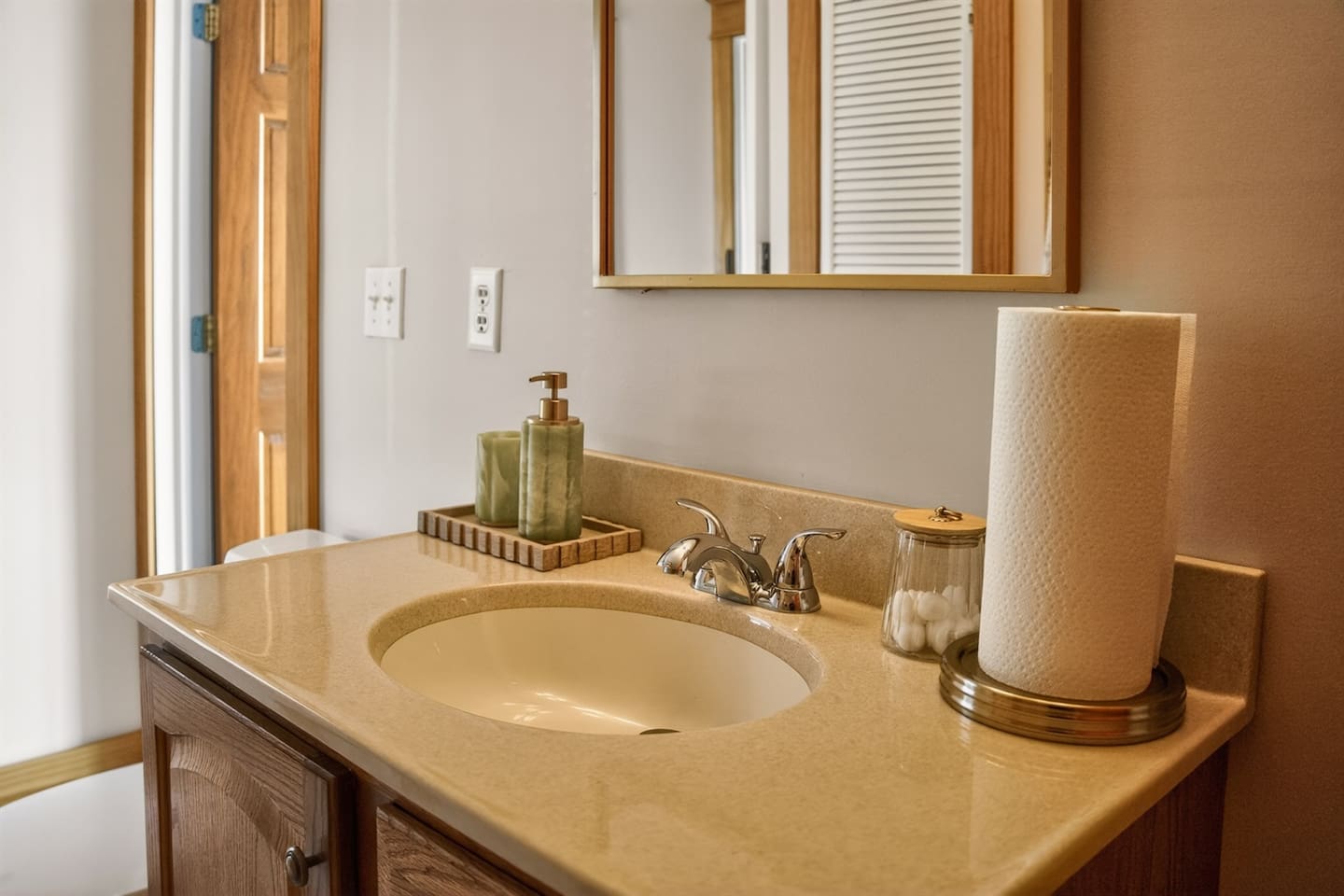 “Clean, modern bathroom with soaking tub and spa-style bath tray—perfect for relaxing and recharging.”