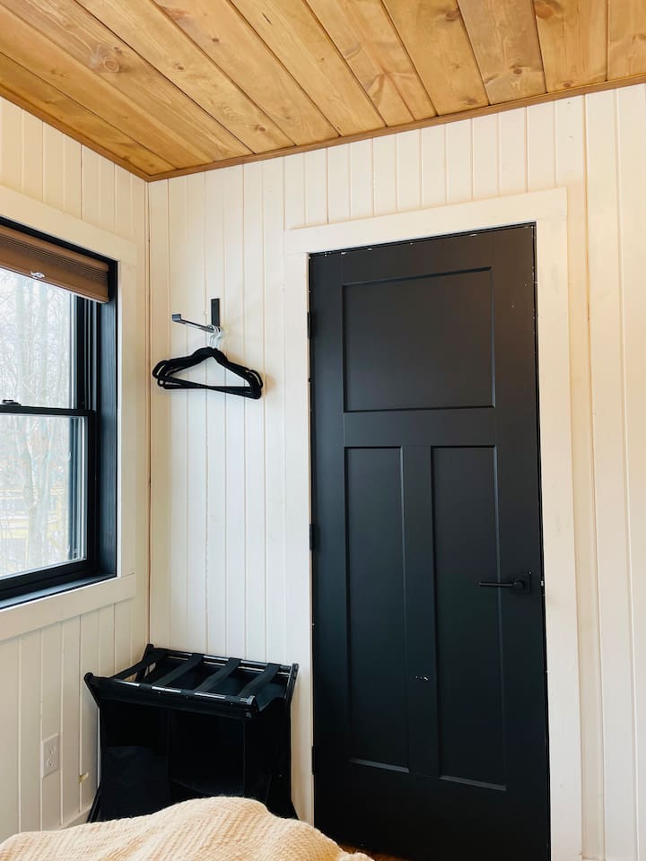 The laundry facilities are in a closet located in bedroom number one.