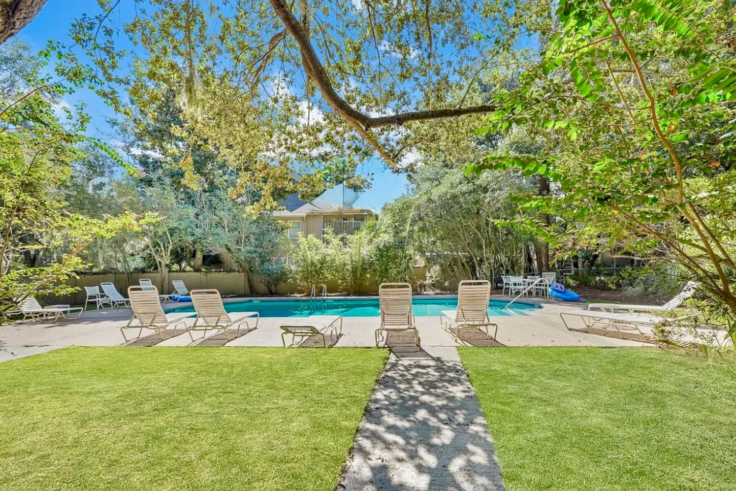 Pool lawn with lounge chairs