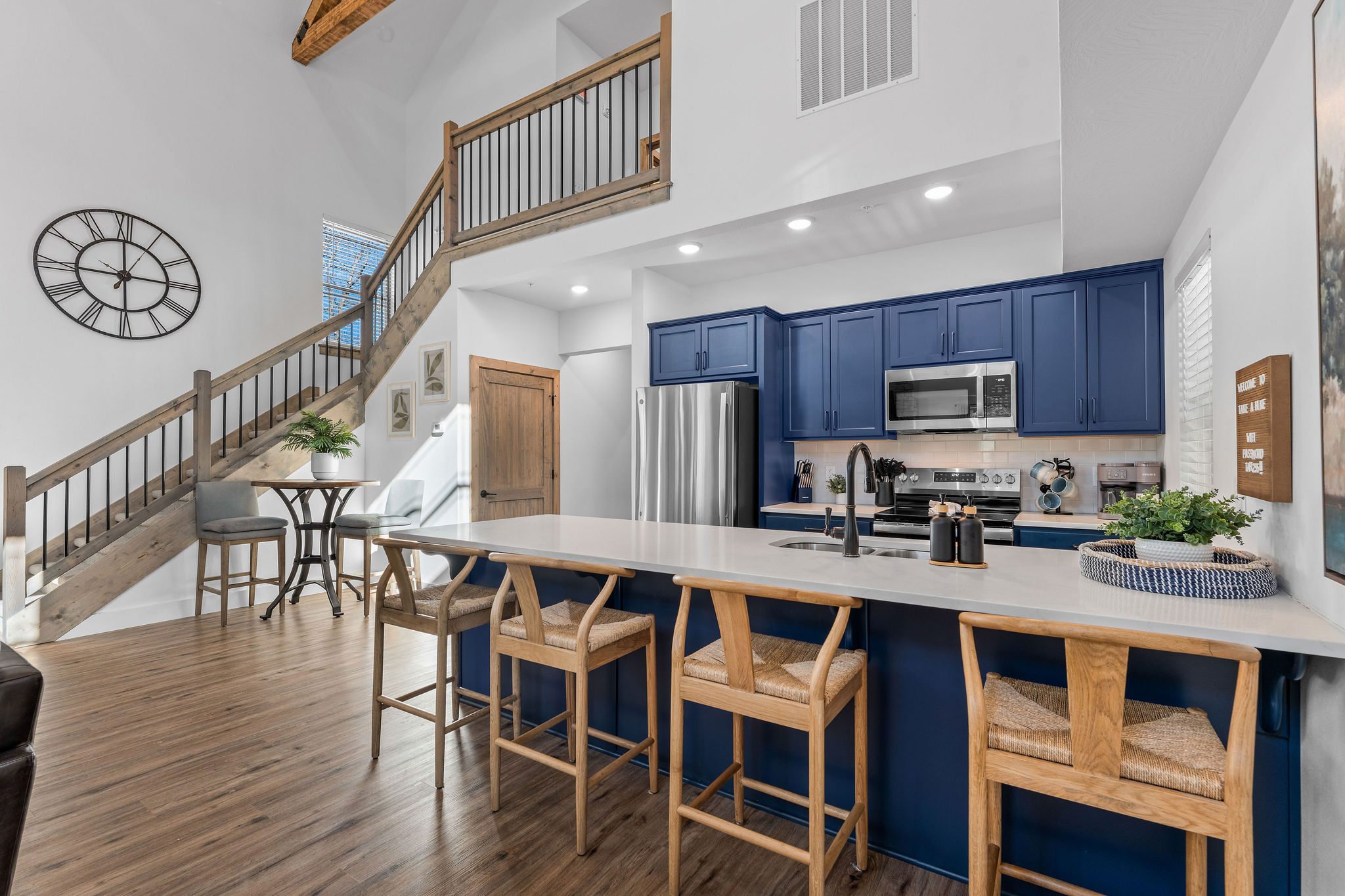 Fully stocked and stylish kitchen and dining space with plenty of seating and natural light.