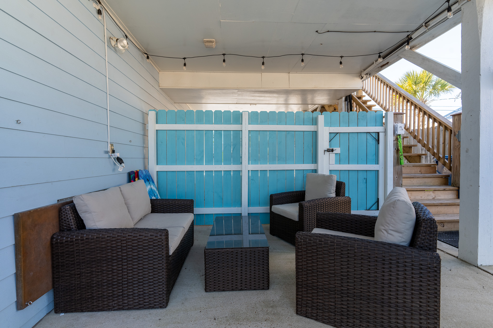 Covered patio seating area that is lit up at night