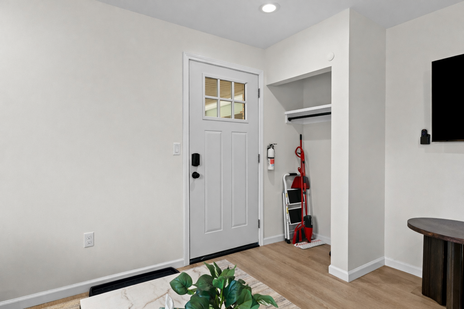 Clean, welcoming entryway with modern finishes, smart lock access, and convenient storage—making arrivals smooth, organized, and stress-free.