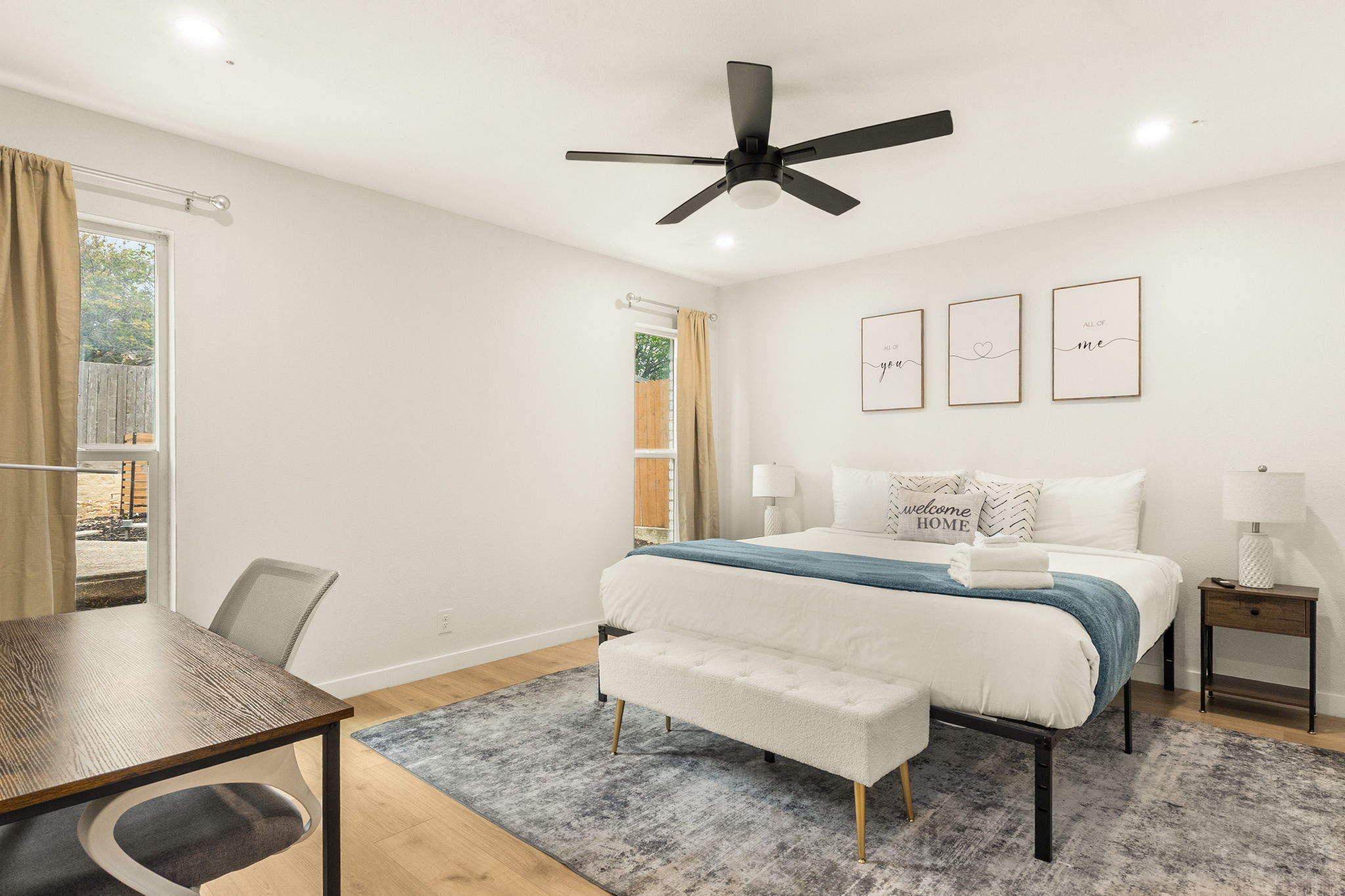 Spacious, airy bedroom with workspace and cozy touches for a restful stay ✨
