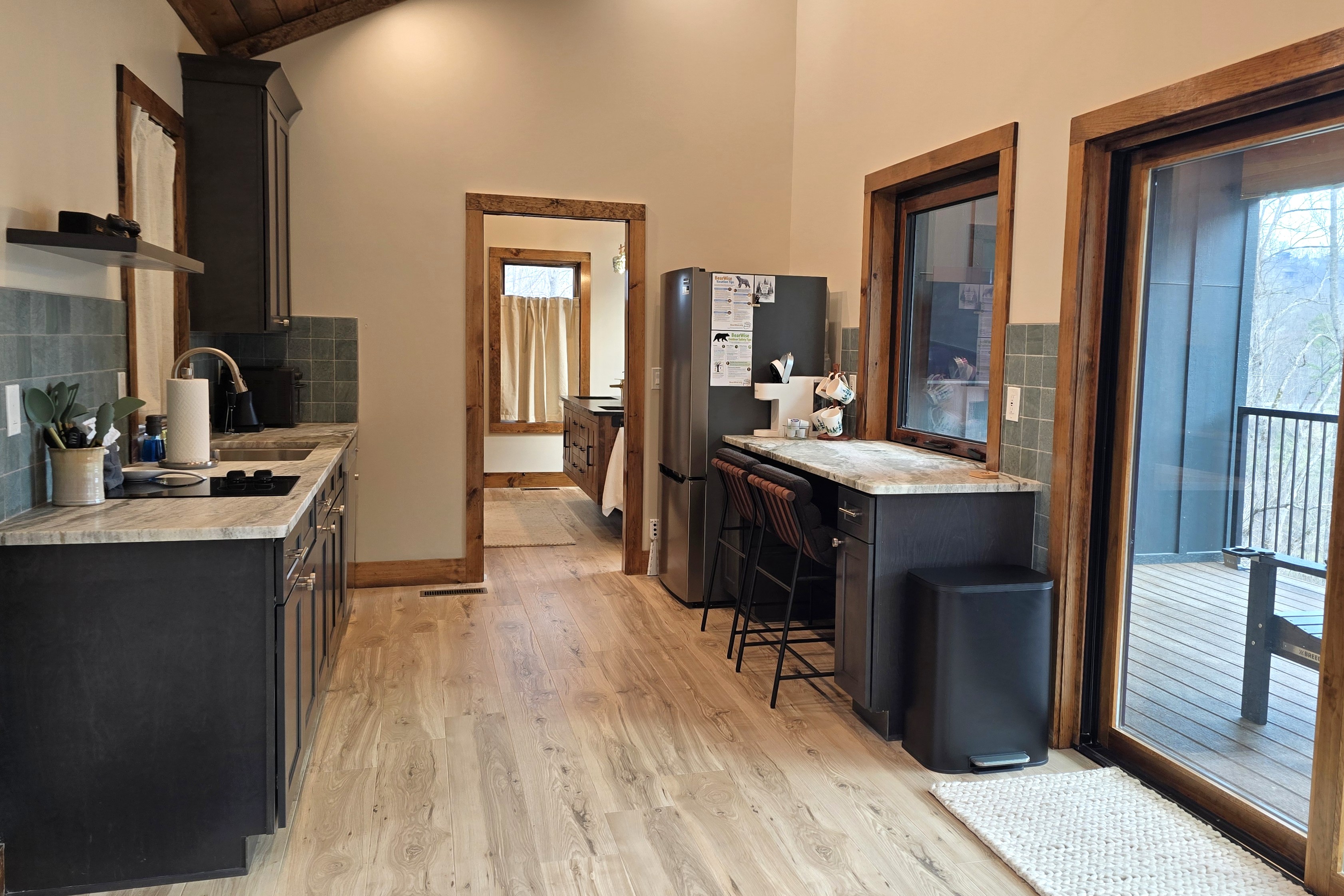 Kitchen and bar leading to bathroom