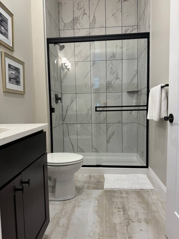 Private en suite accessible from Bedroom 3 with shower and single sink.