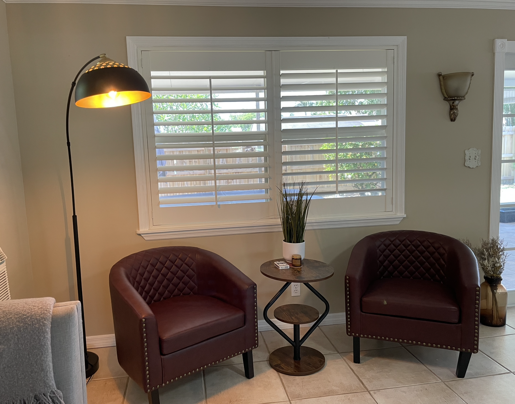 Our expansive rear living room has an abundance of seating and cozy nooks, as well as a comfortable couch with recliners.