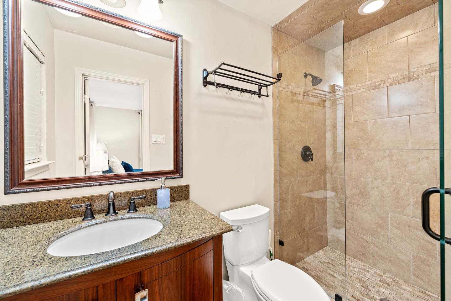 Step into a beautifully tiled walk-in shower stocked with premium shampoo, conditioner, and body wash.