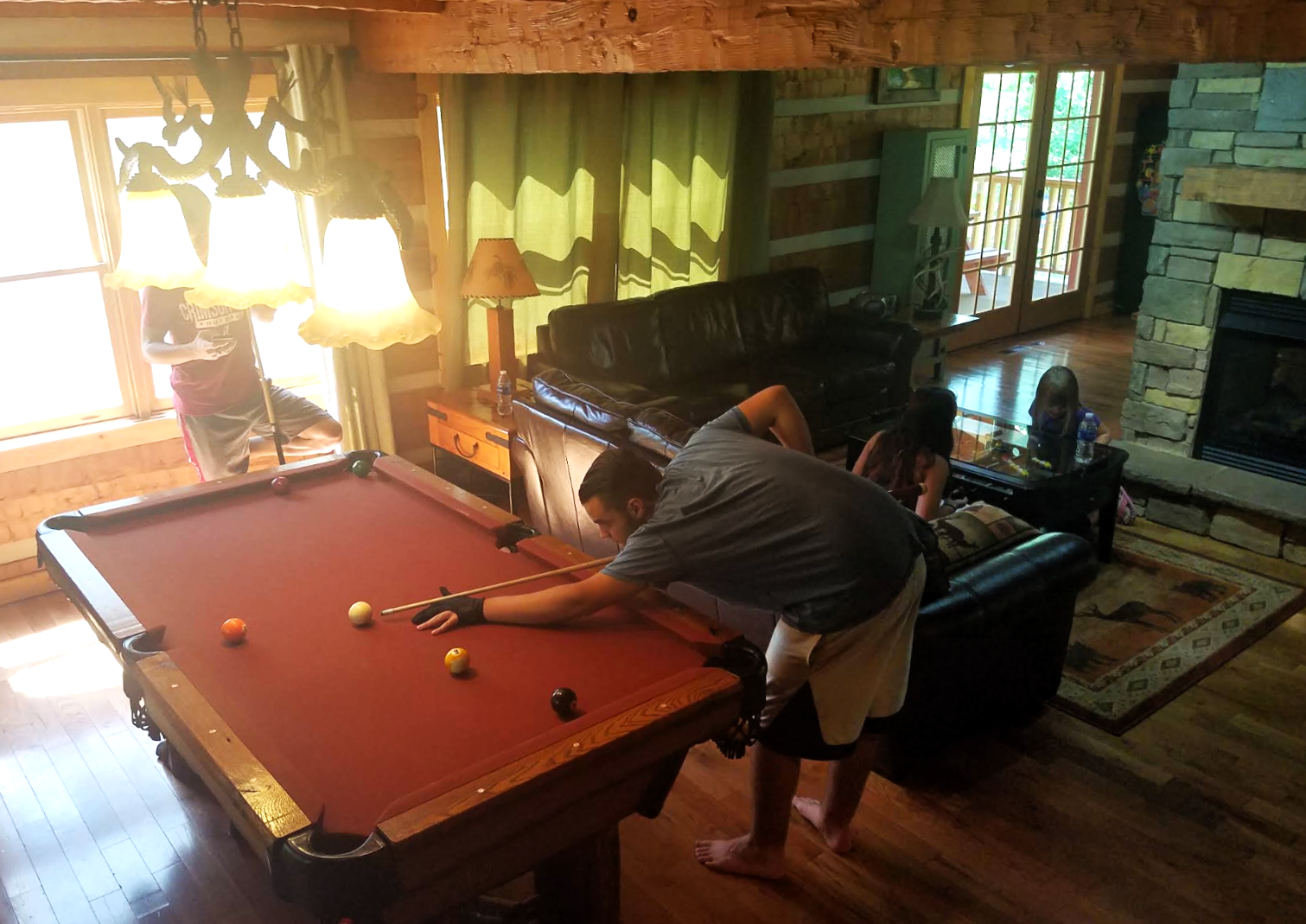 playing pool in Appalachian Ecsape cabin in the Smokies