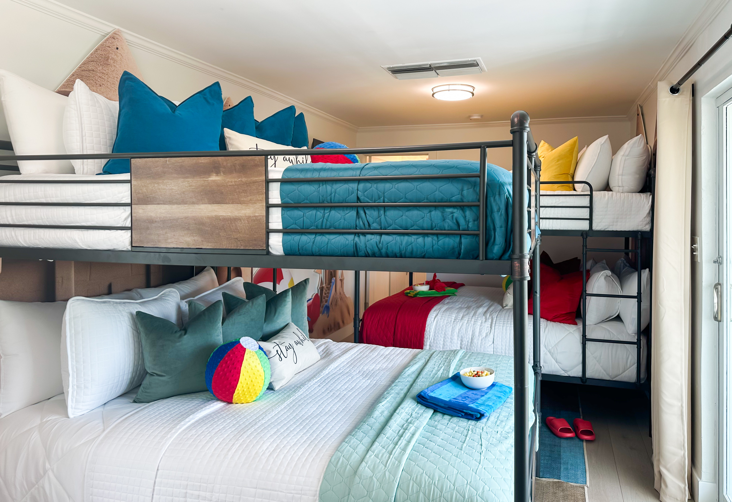 This bedroom has 2 Queen over Queen bunk beds for a total of 4 beds.