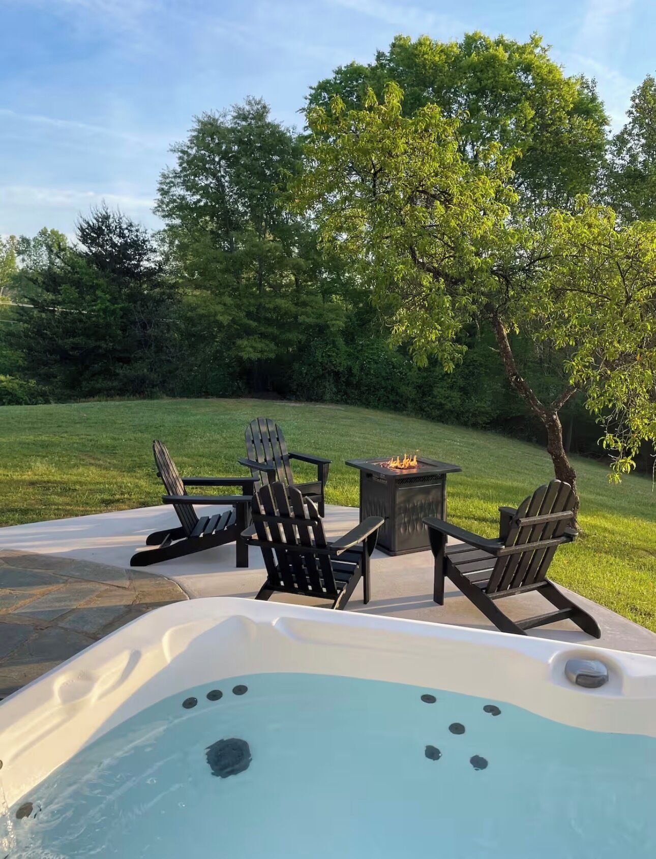 The back patio with large backyard is perfect for your group