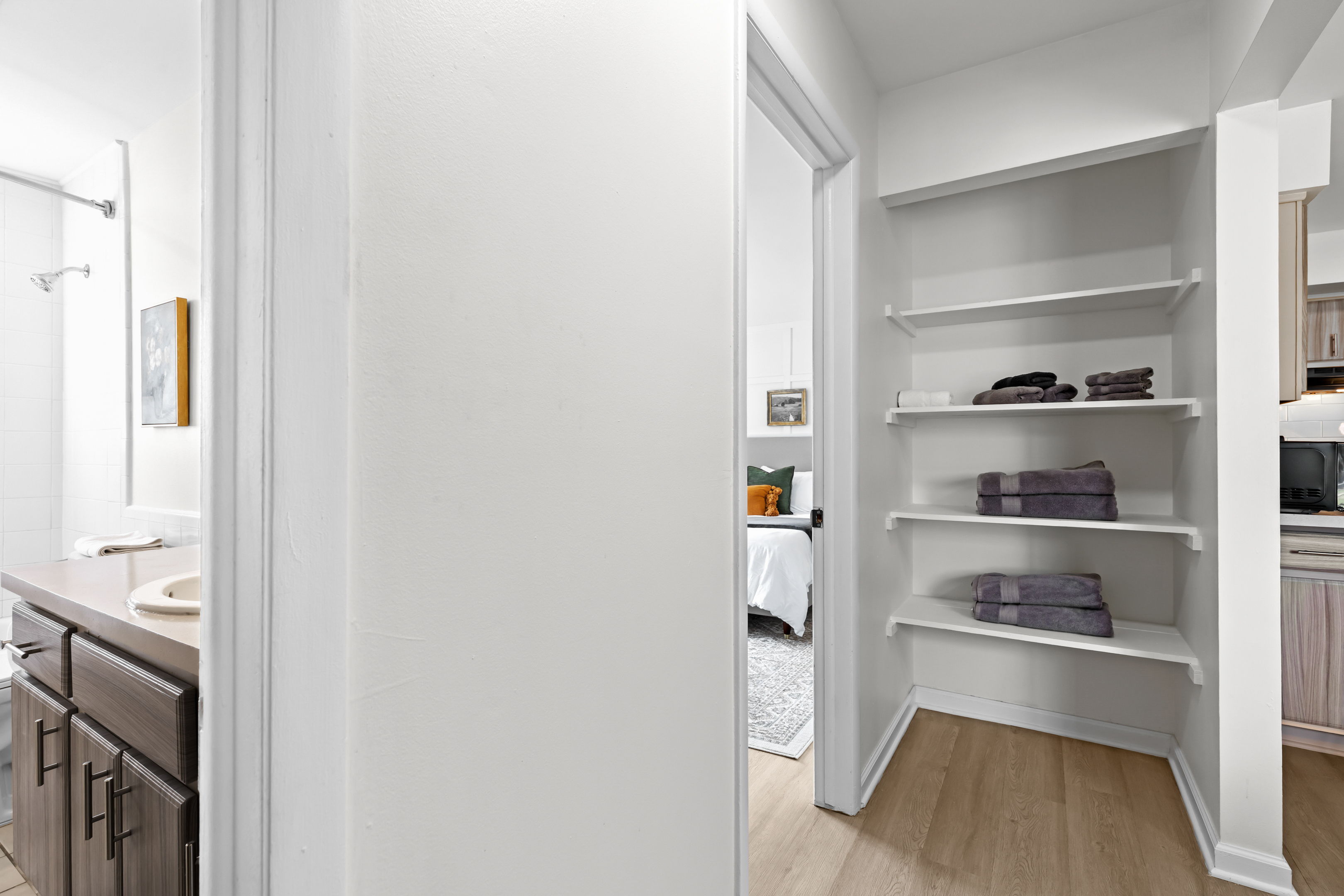 Convenient built-in shelving for linens, towels, or personal belongings.