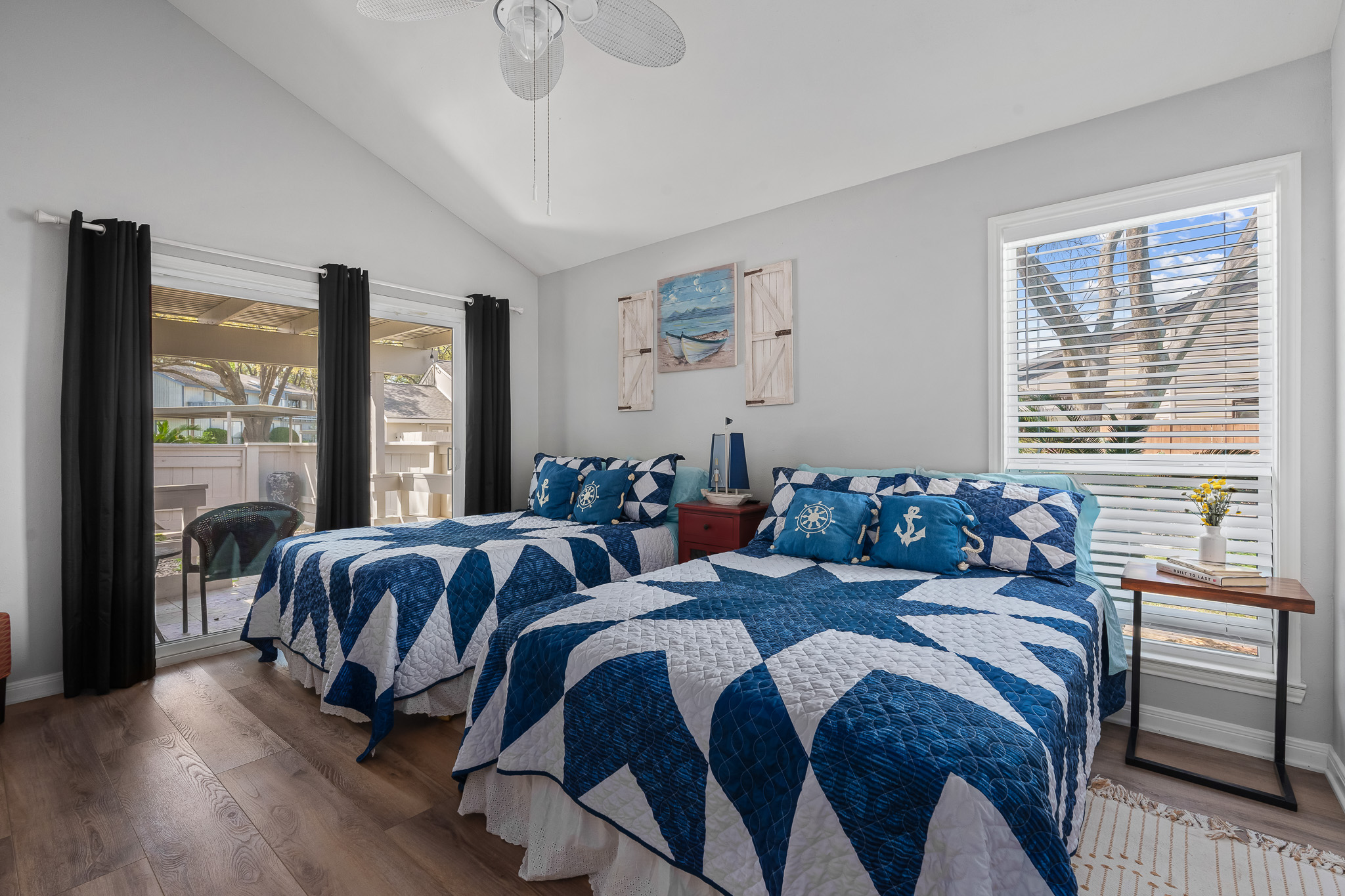 Wake up to soft natural light and plenty of space in this bright, beachy guest room—ideal for morning coffee by the window or winding down with a book. 