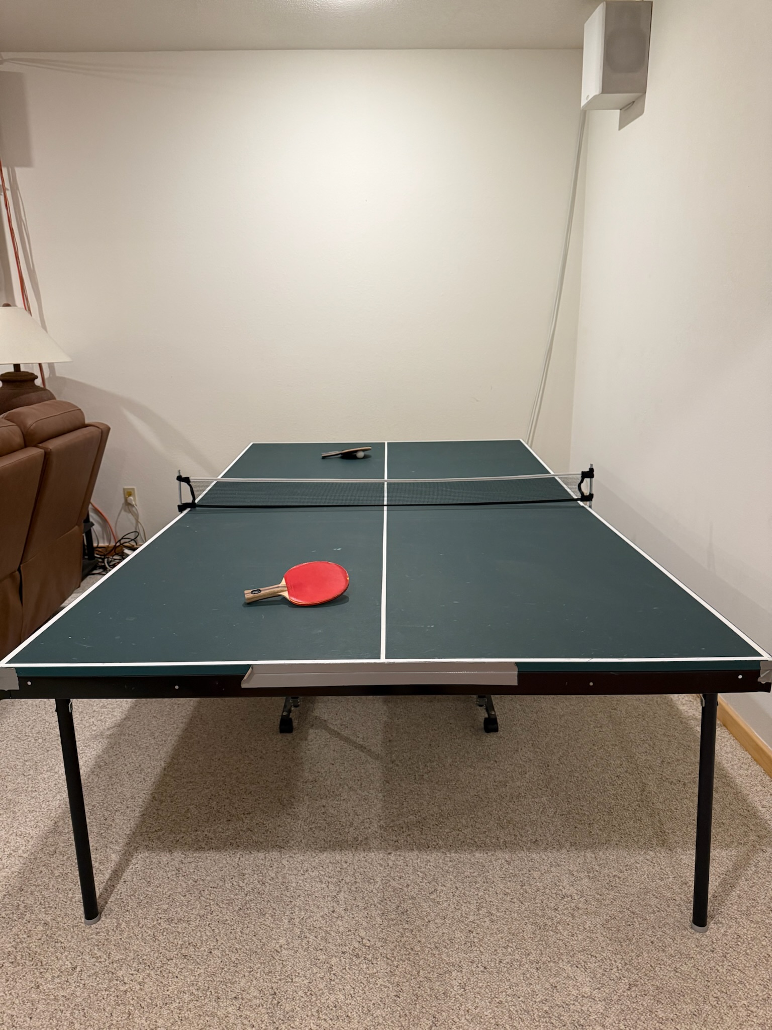 Ping pong table downstairs, ready to play!