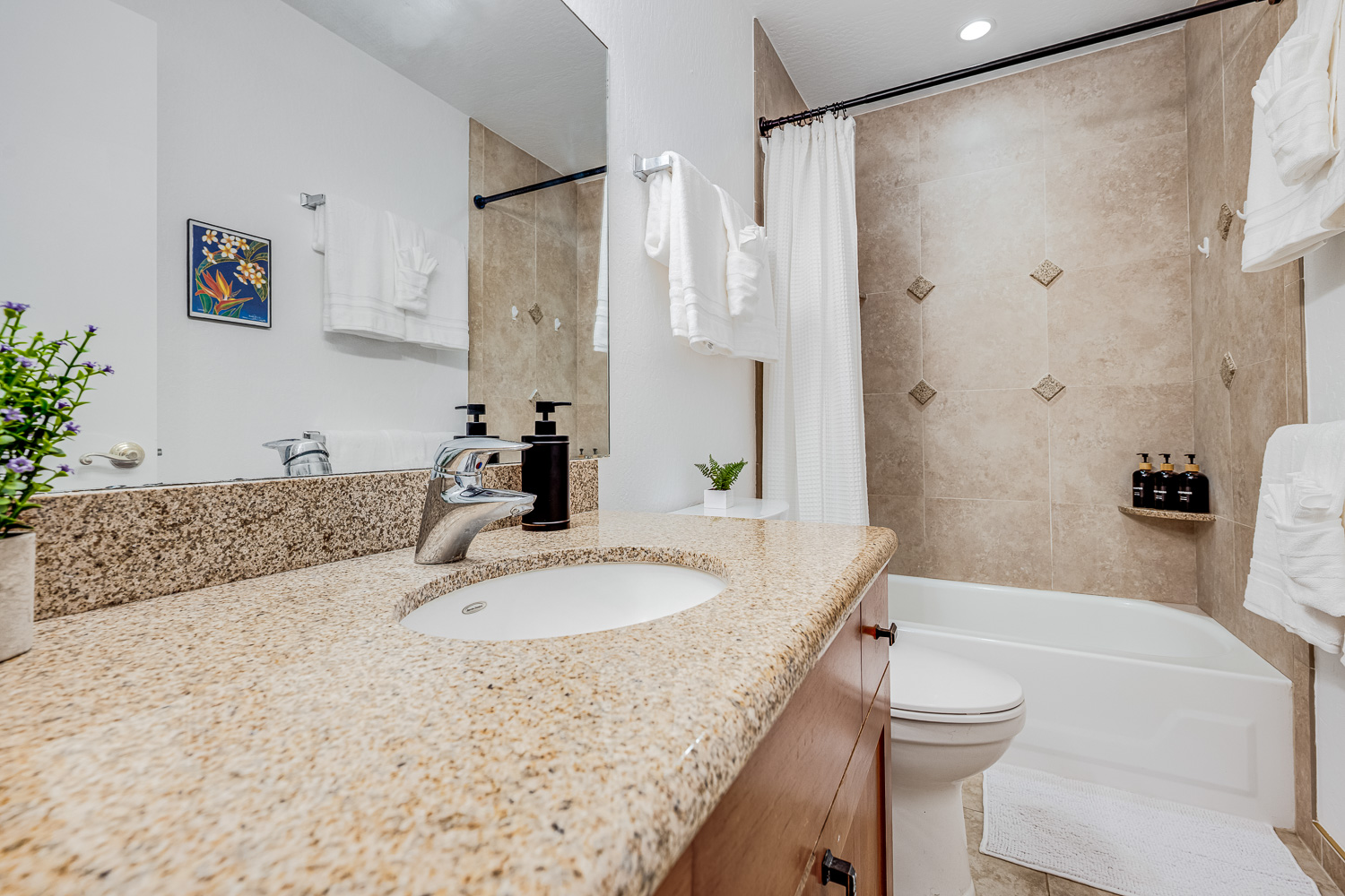 Bright, welcoming bathroom with full tub and shower