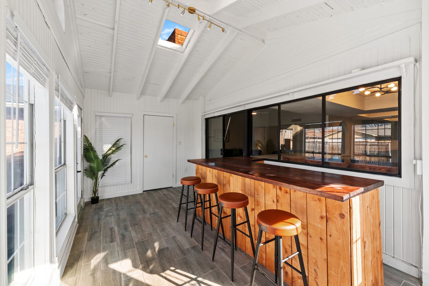 Host happy hour in the sunroom—your private indoor bar with seating for four and classic board games for laid-back fun.