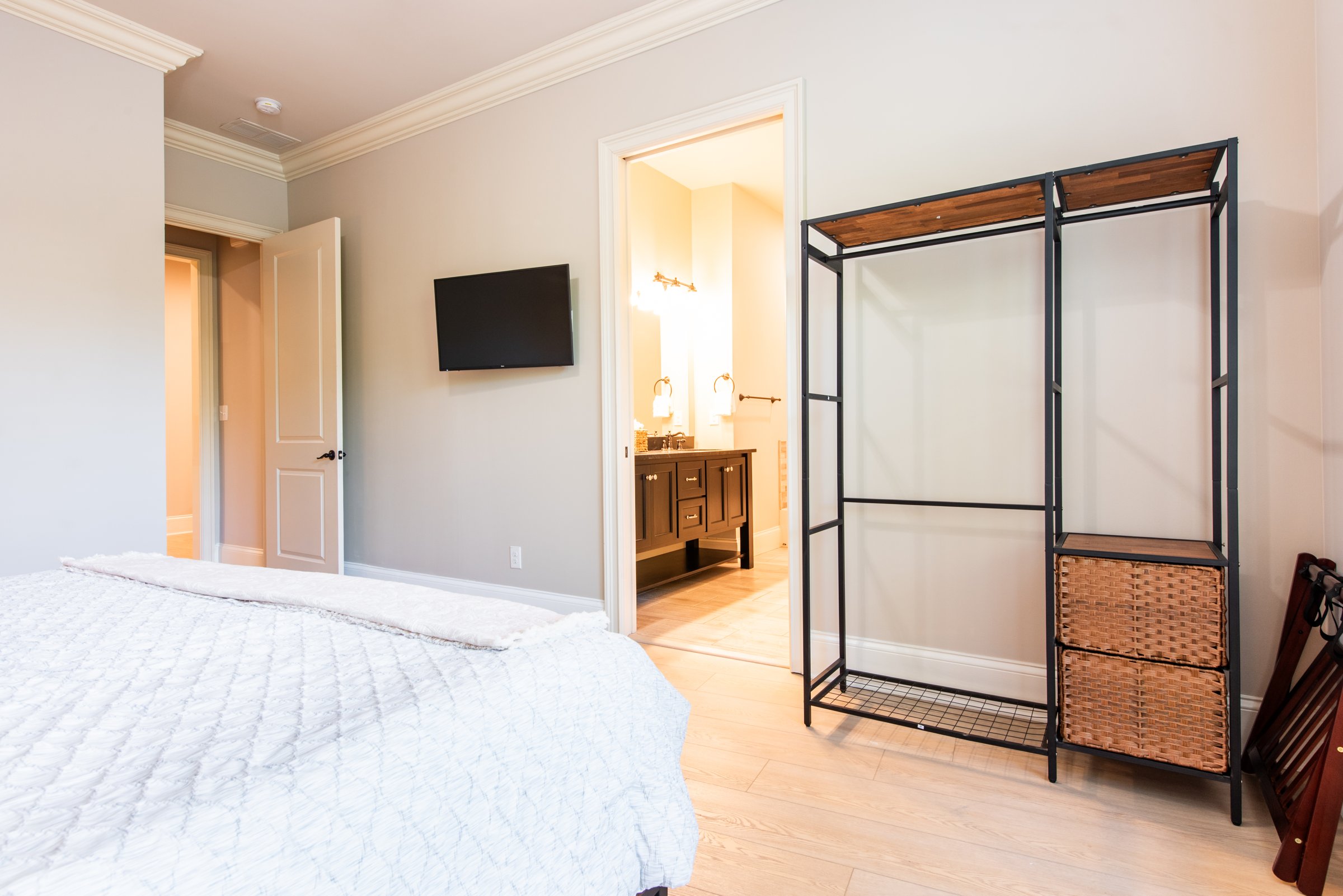 Wall-mounted TV and direct access to the ensuite bathroom.