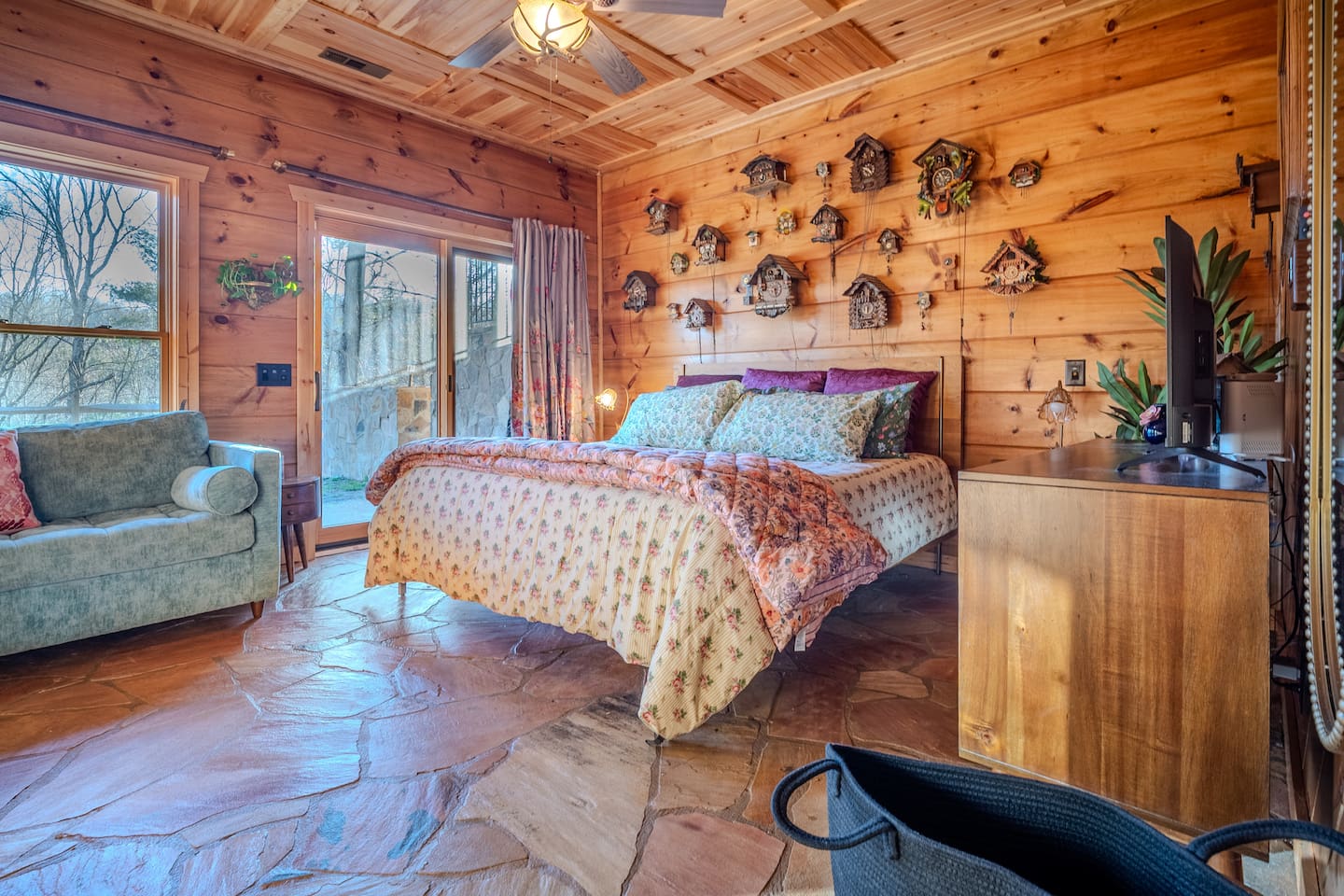 The Cuckoo room on the bottom floor offers cute decor, a large closet, very comfy king bed, sitting area, private en suite bath, and walk out to the hot tub and yard. 