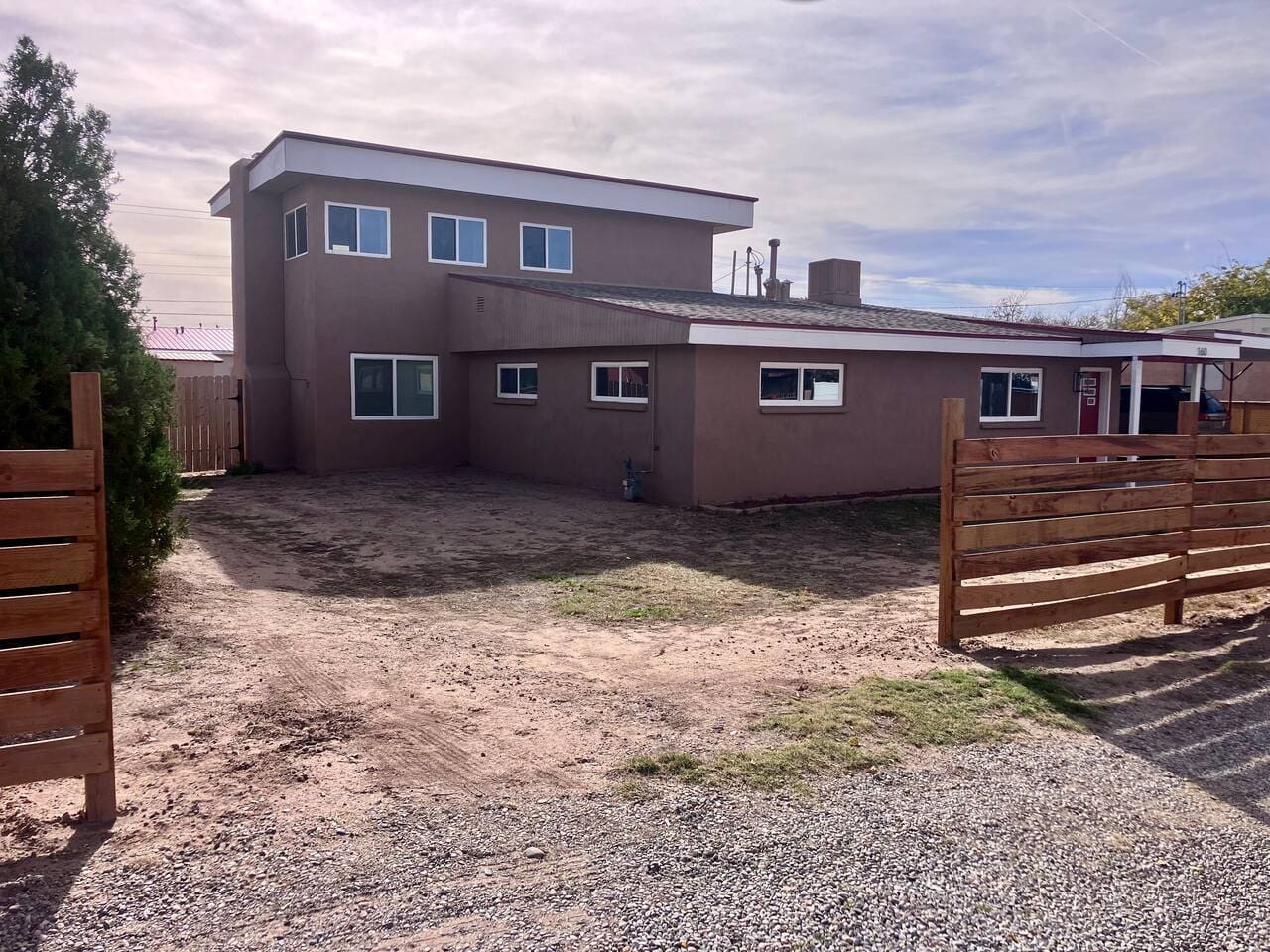 We are waiting on the landscapers for full curb appeal. But you can pull your RV, trailers, or vehicles into the back yard through this gate. 30amp hookup back there. 