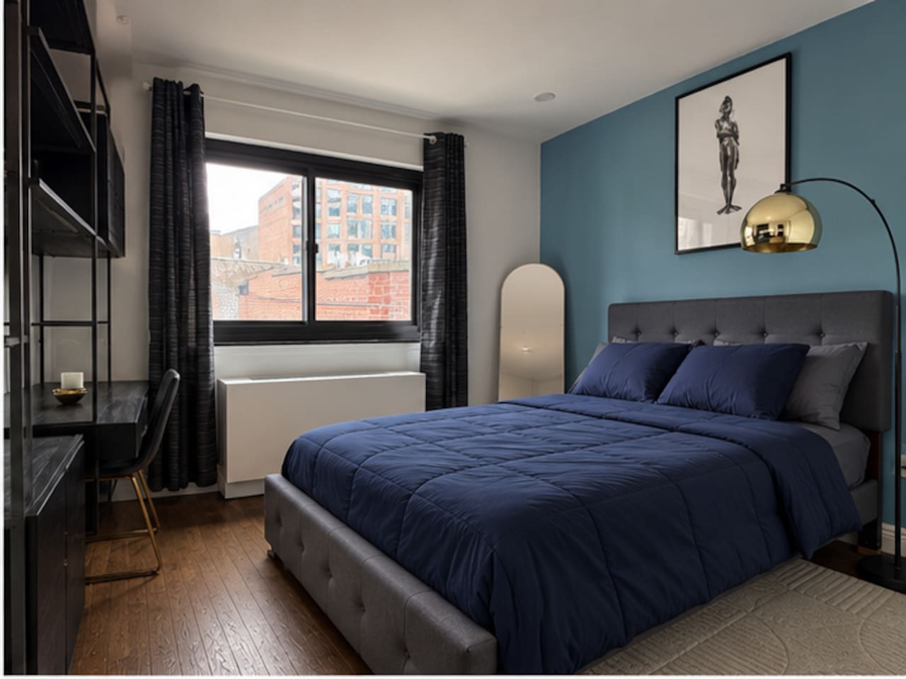Spacious primary bedroom with city views — Little Italy NYC 2-bedroom apartment rental.