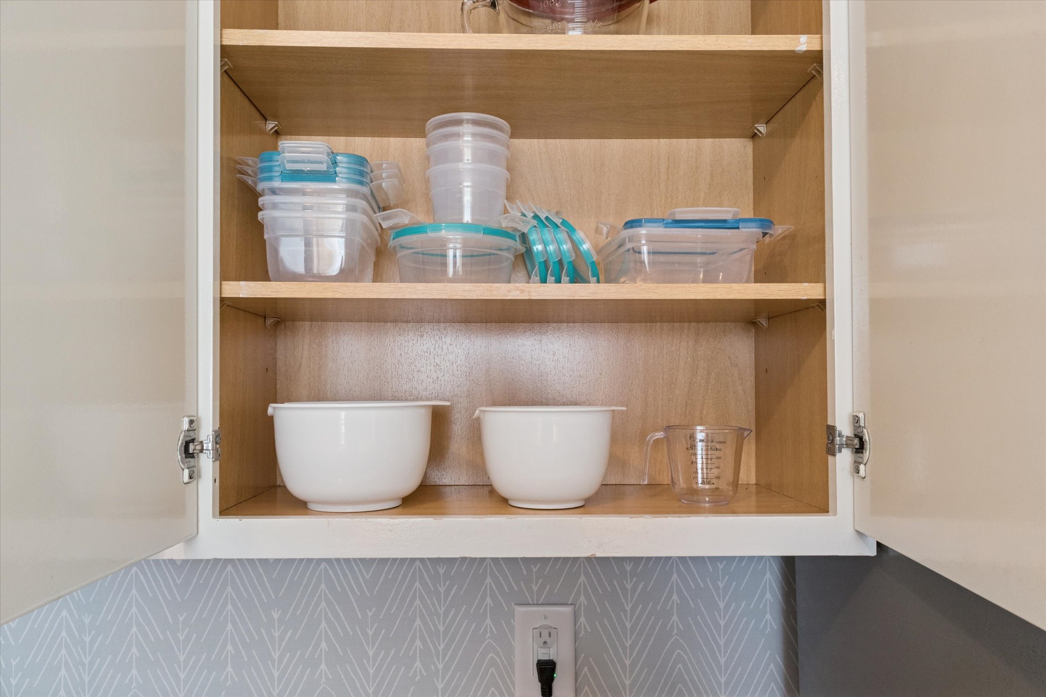 Stay in comfort and cook with ease at our South Bend vacation rental! Featuring mixing bowls, storage containers, measuring cups, and all the kitchen essentials for your getaway.